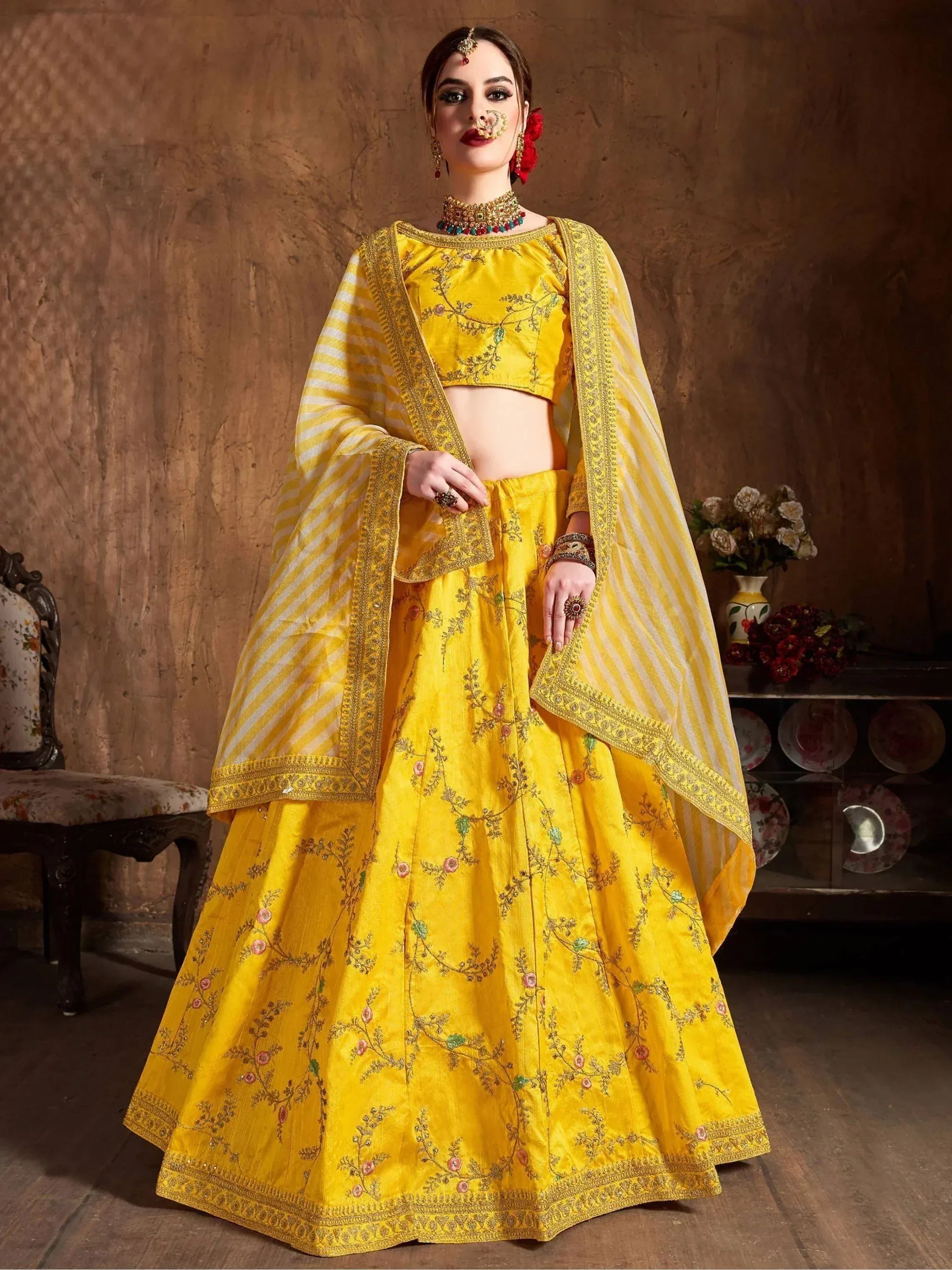 Yellow embroidered lehenga choli with floral motifs and striped dupatta, Indian ethnic wear