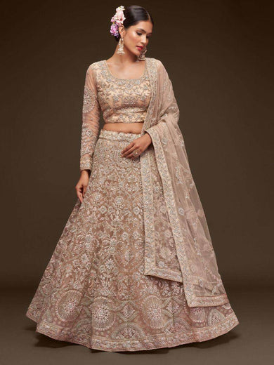 Ravishing Beige Embroidered Soft Net Ceremony Wear Lehenga Choli