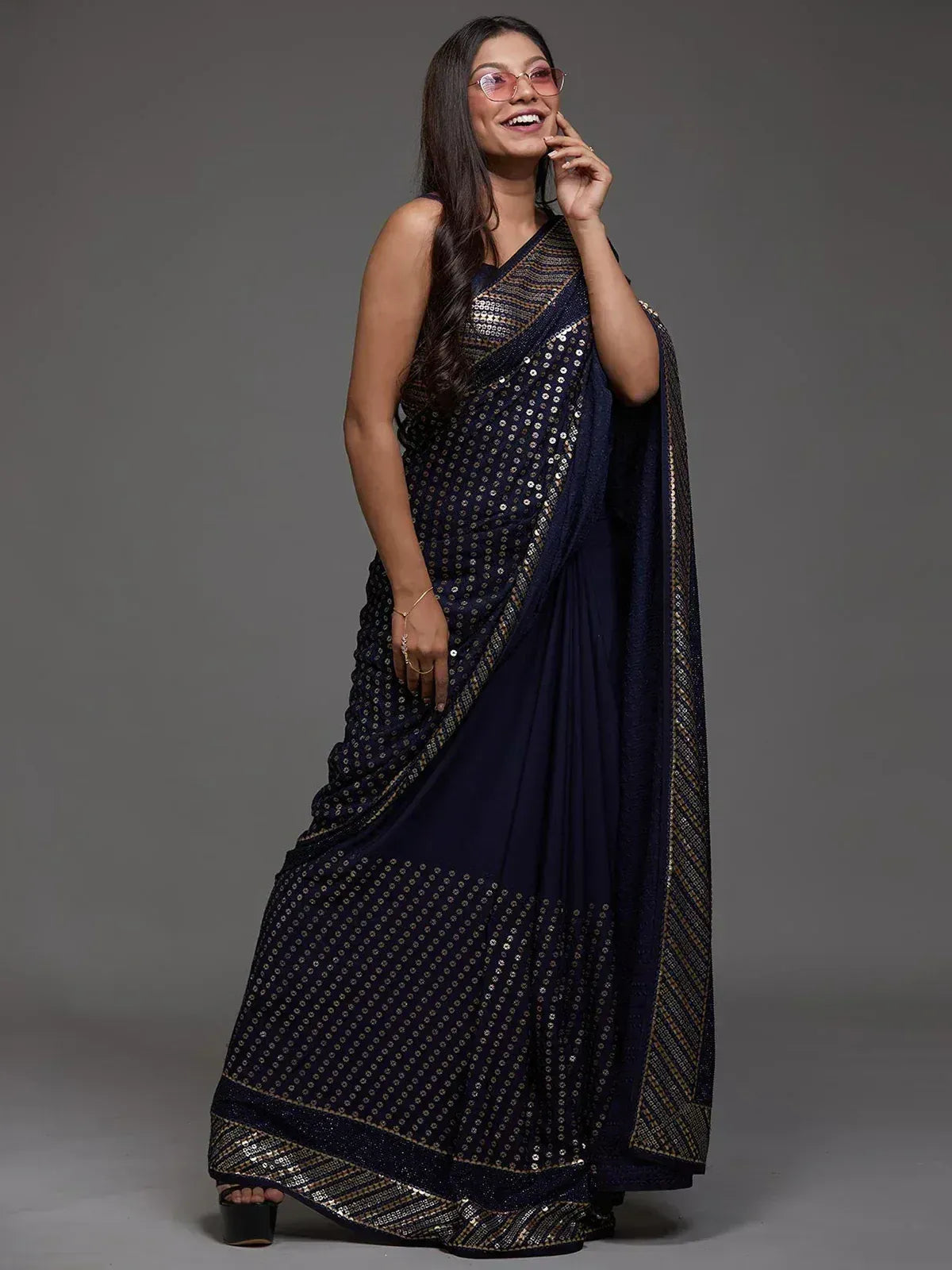 Navy blue sequin saree with gold border, elegant Indian ethnic wear for women