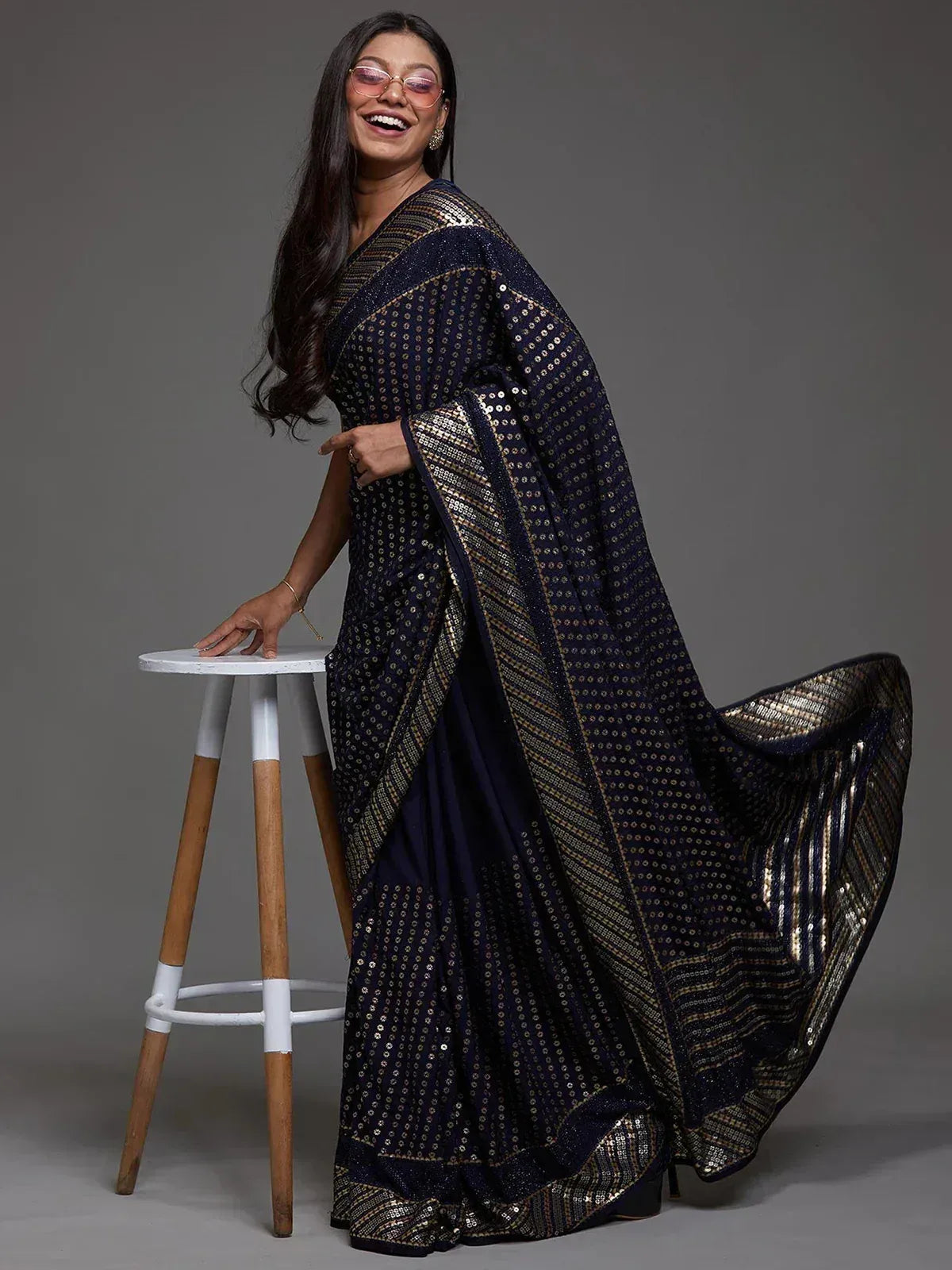 Navy blue sequin saree with gold border, elegant ethnic wear for women