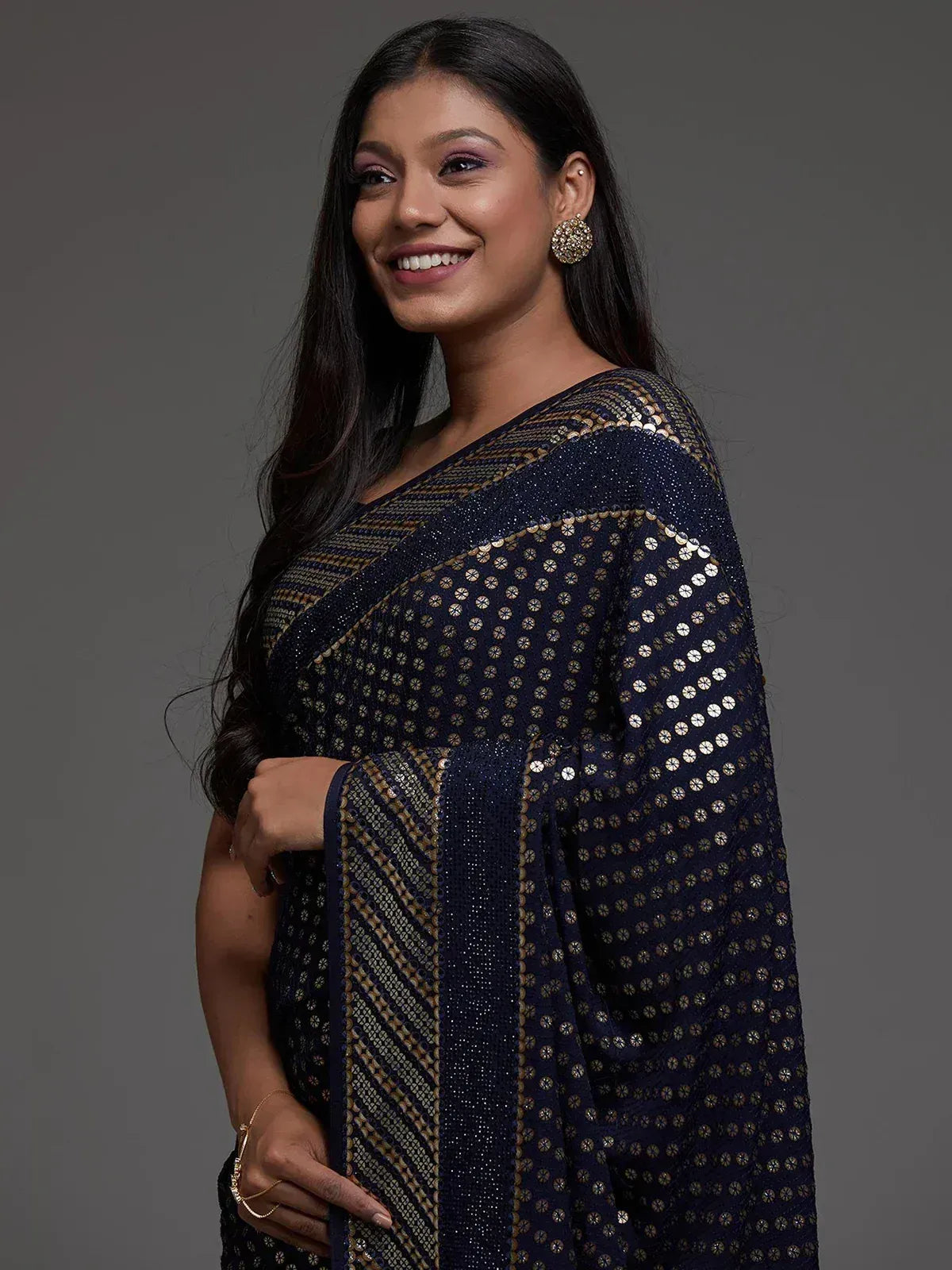 Navy blue saree with gold sequin and geometric patterns, elegant Indian ethnic wear