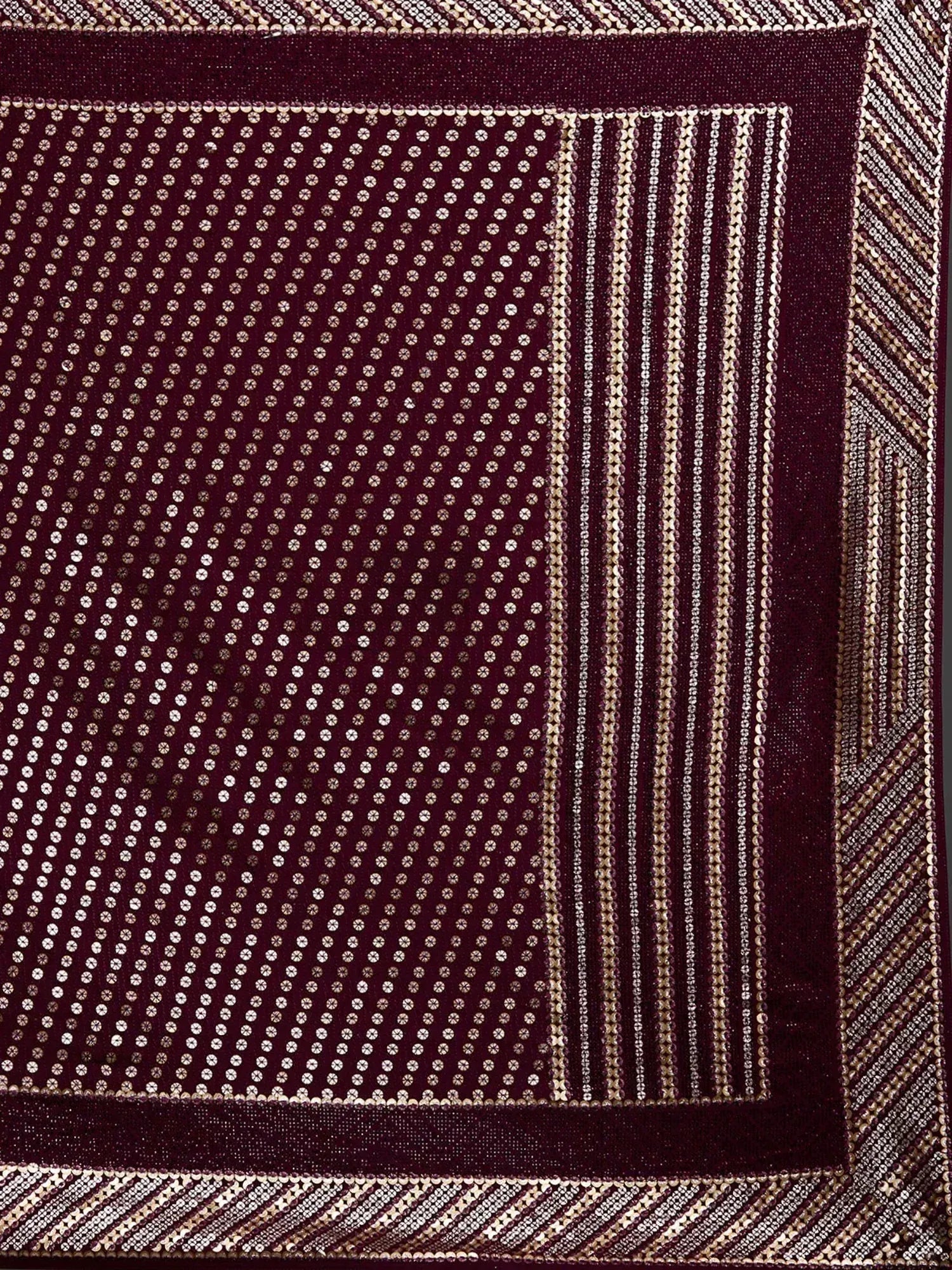 Maroon ethnic fabric with intricate gold sequin patterns and border designs for sarees or lehenga