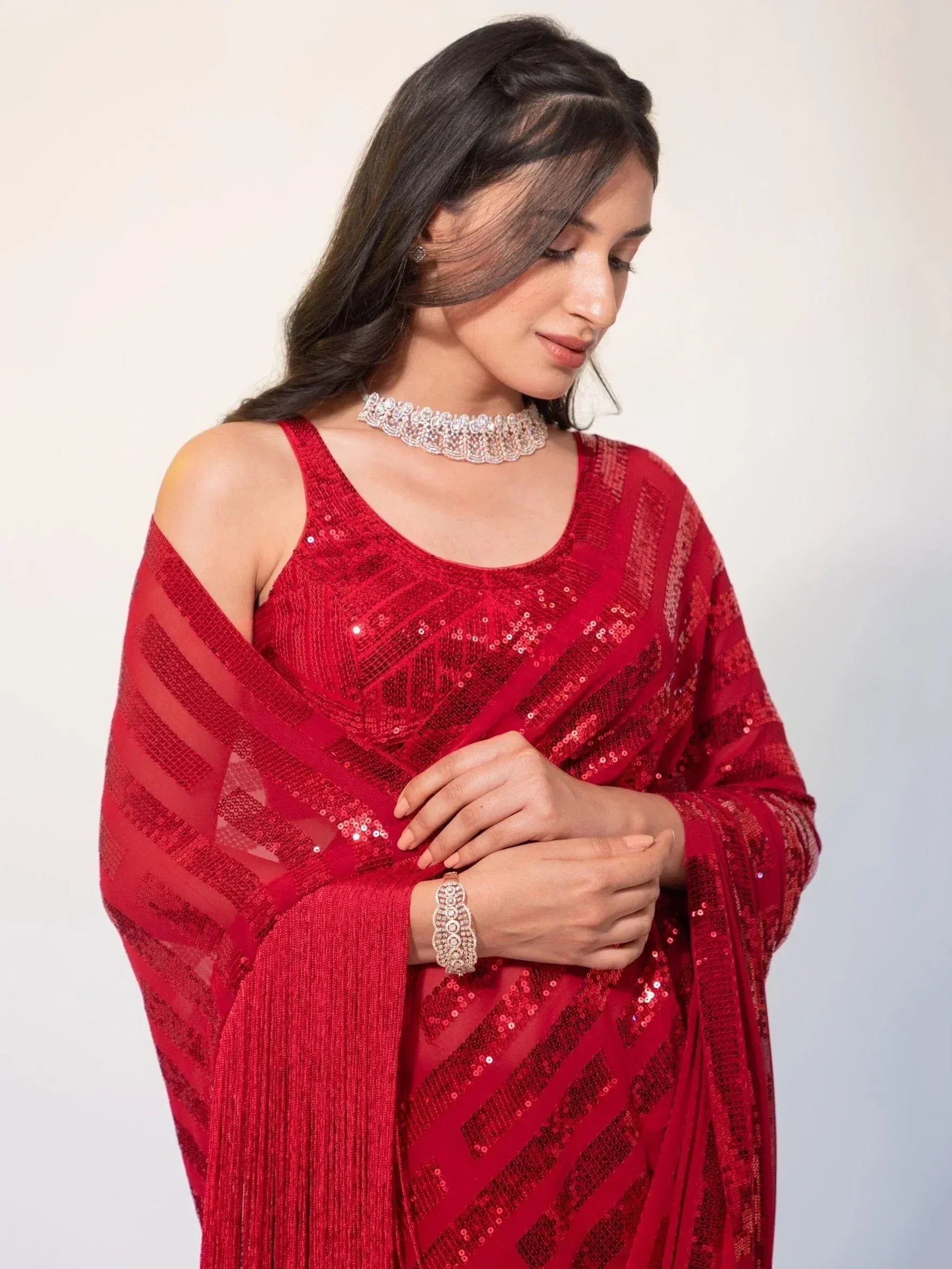 Red sequin ethnic gown with sheer cape, perfect for Indian weddings and festive occasions