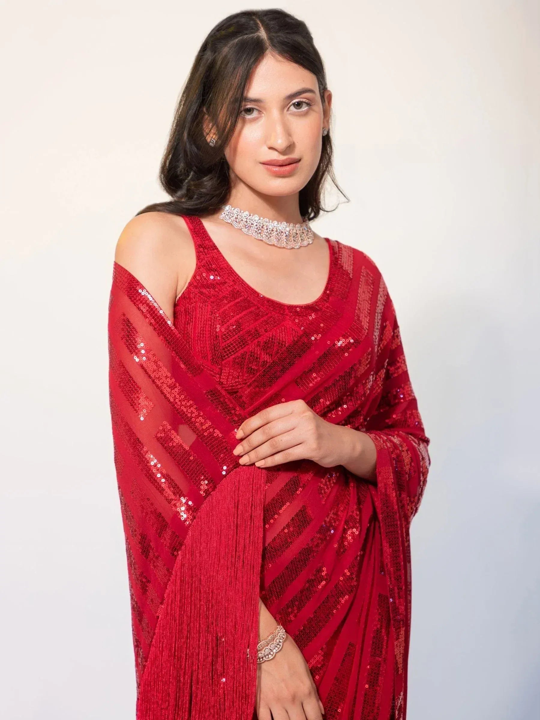 Red sequin saree with cold shoulder blouse, perfect for Indian ethnic wear events