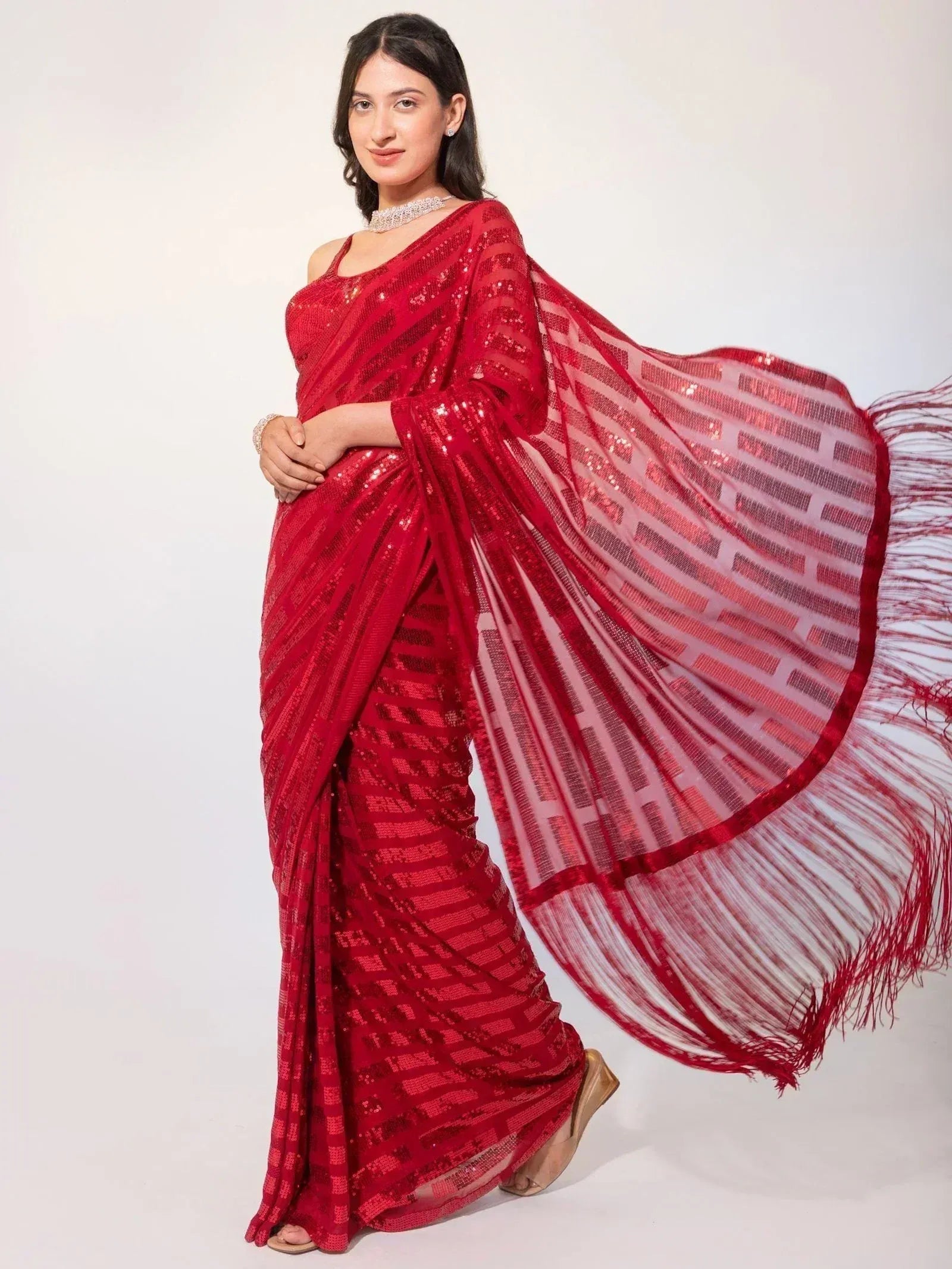 Red sequin saree with fringe border, elegant Indian ethnic wear for festive occasions