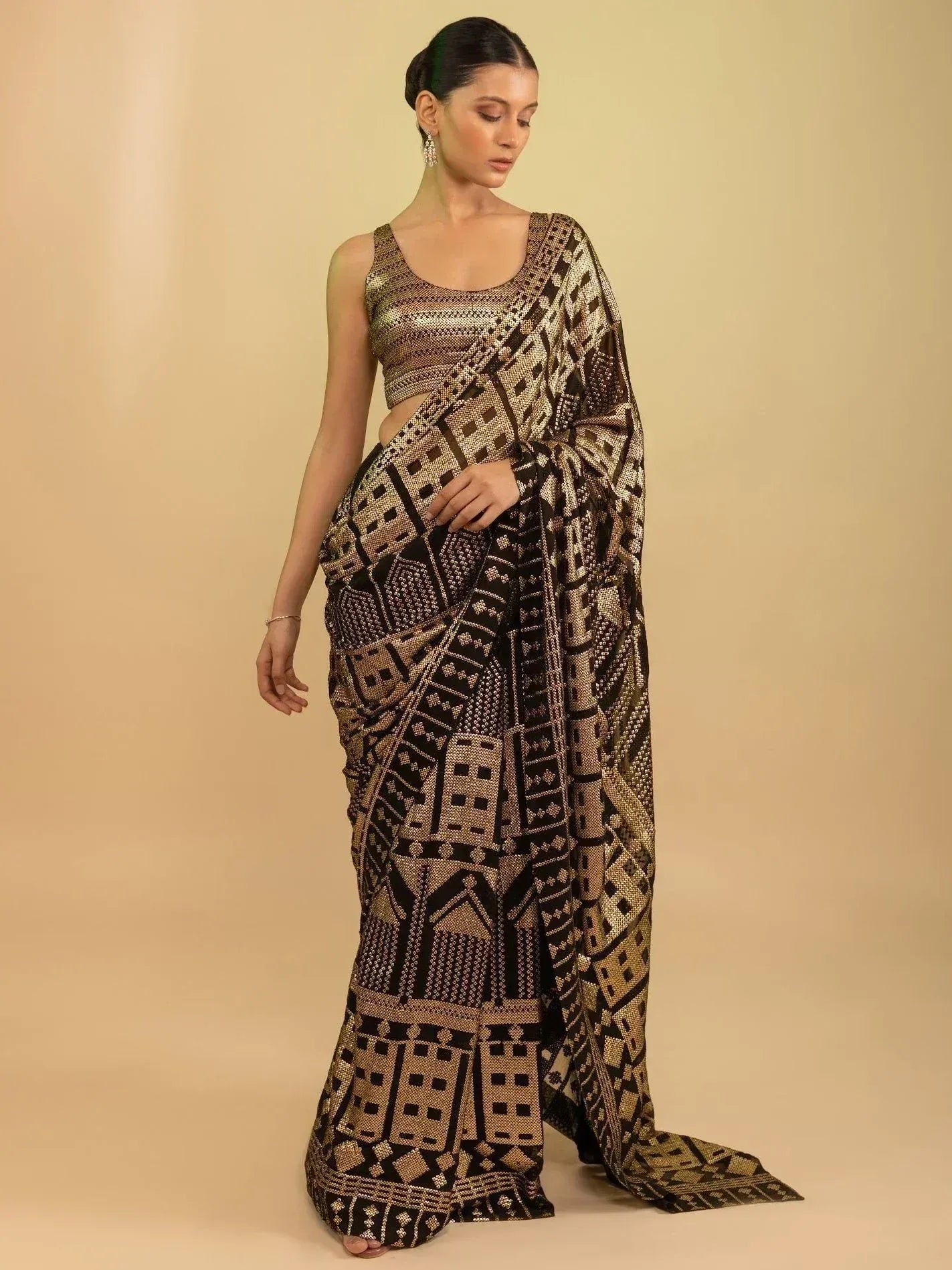 Black and gold geometric print saree with matching blouse, elegant ethnic wear for women
