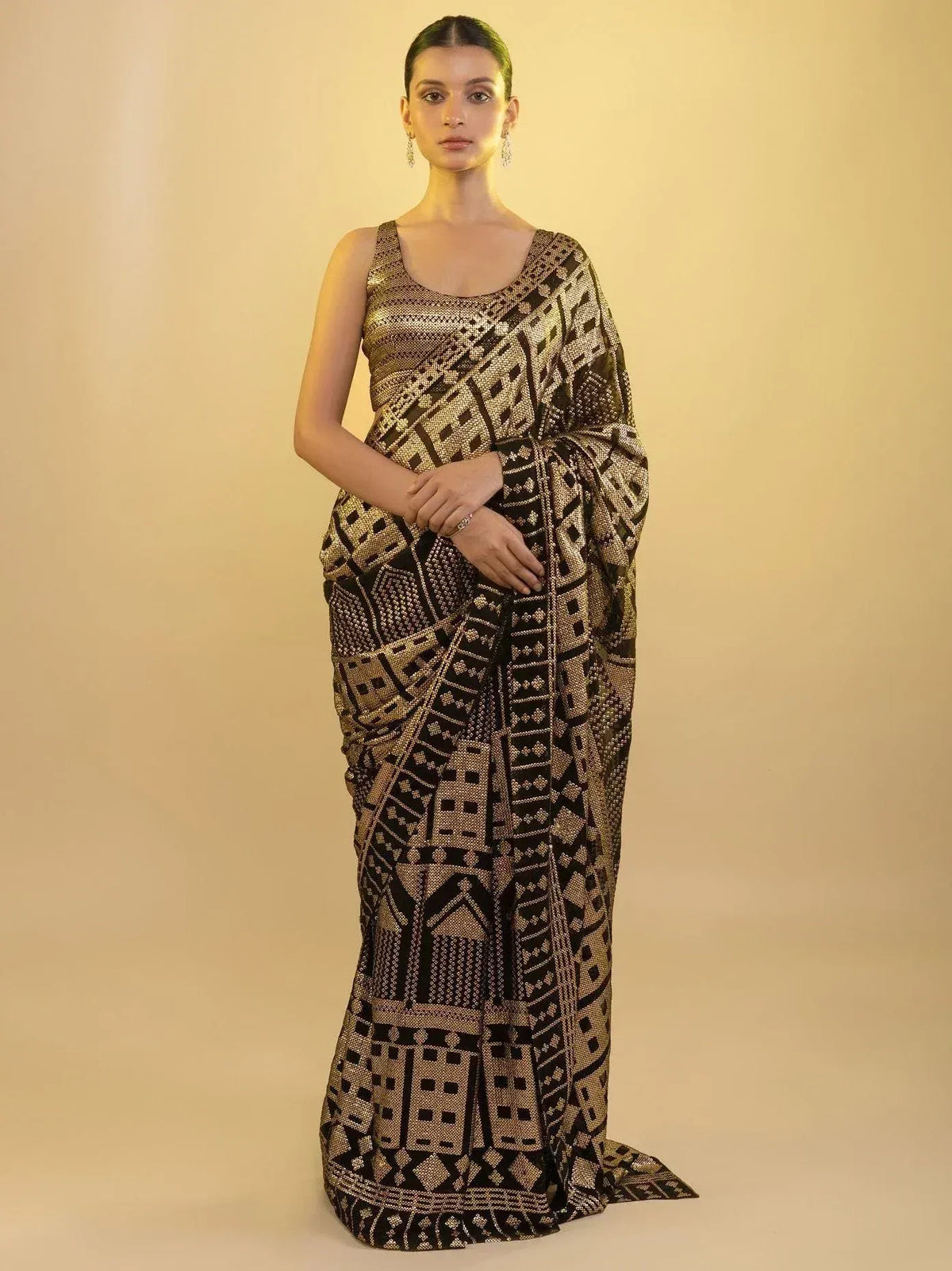 Black and gold geometric print saree with sleeveless blouse, ethnic Indian wear
