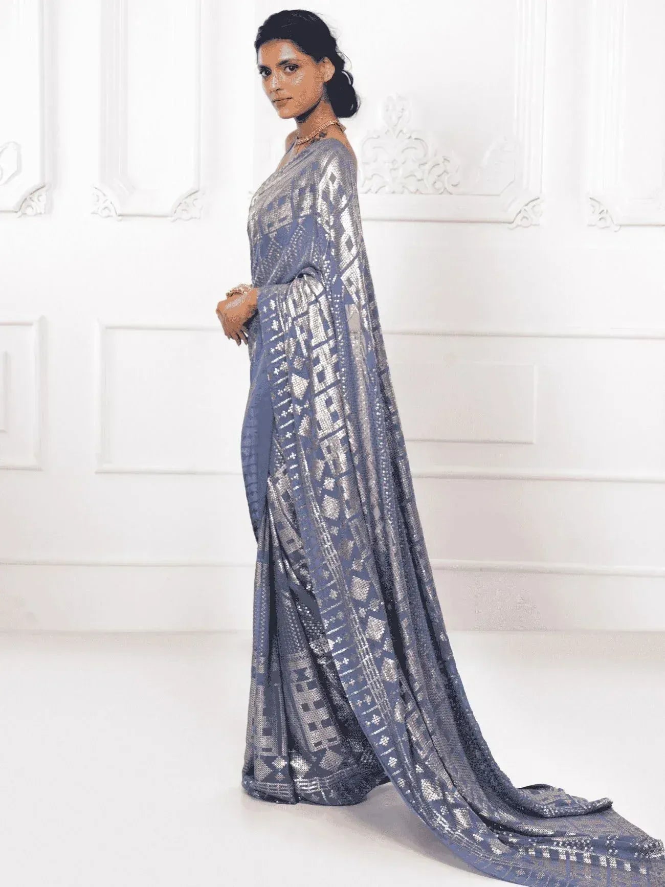 Blue and silver embroidered saree with geometric patterns, elegant ethnic wear for women