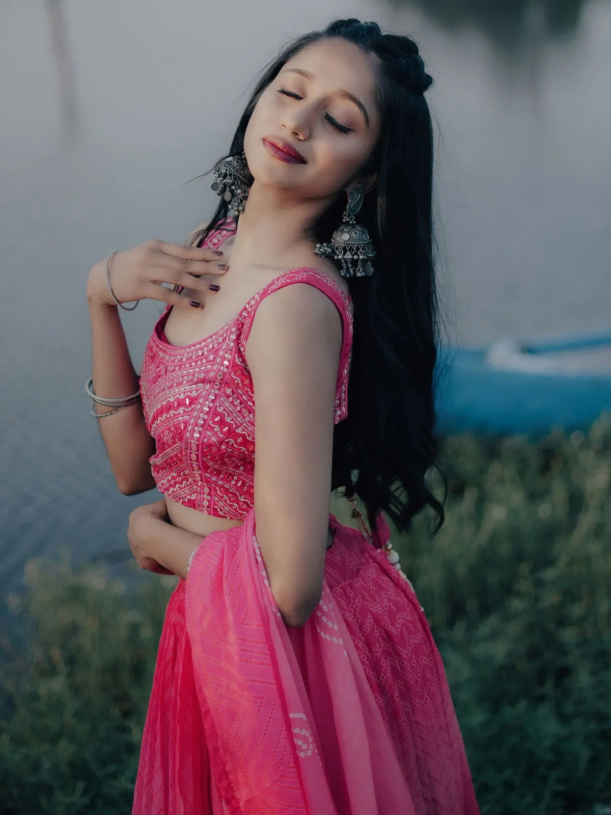 Pink embroidered lehenga choli with jhumka earrings, perfect for Indian ethnic wear