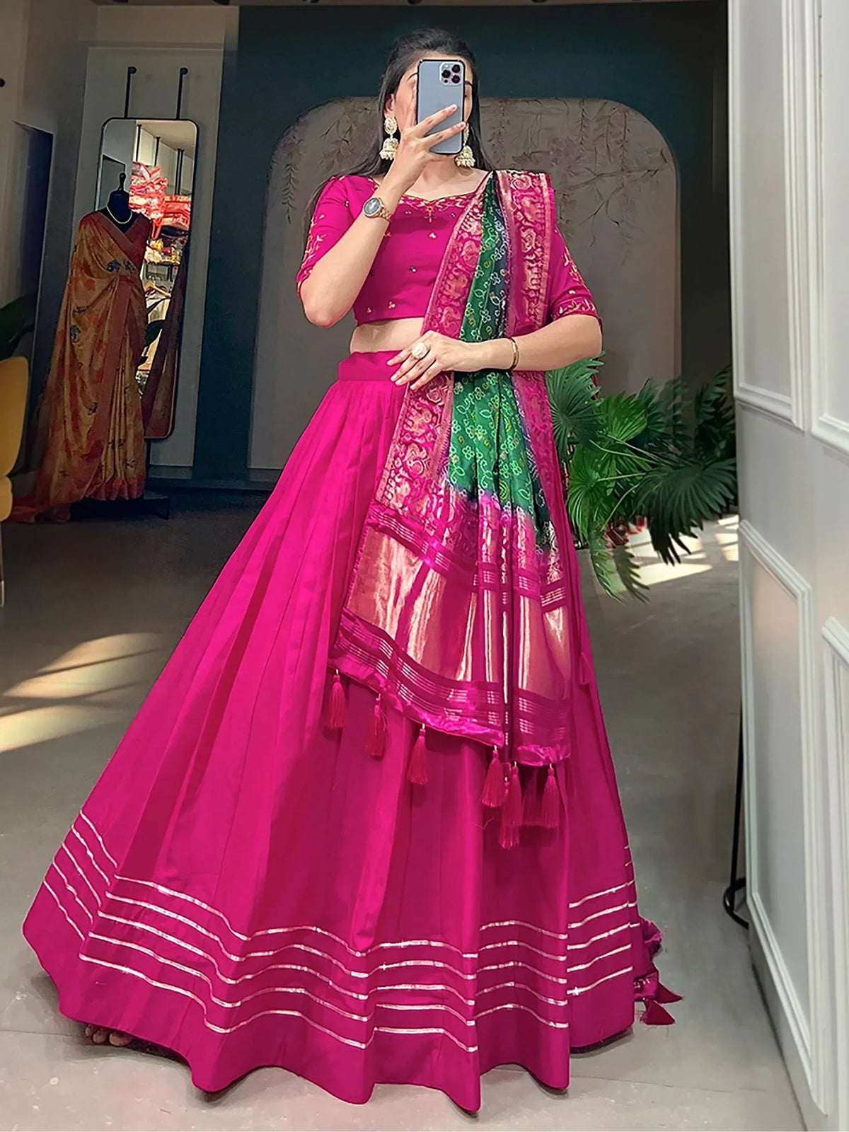 Vibrant pink lehenga choli with green dupatta, perfect for Indian ethnic wear occasions