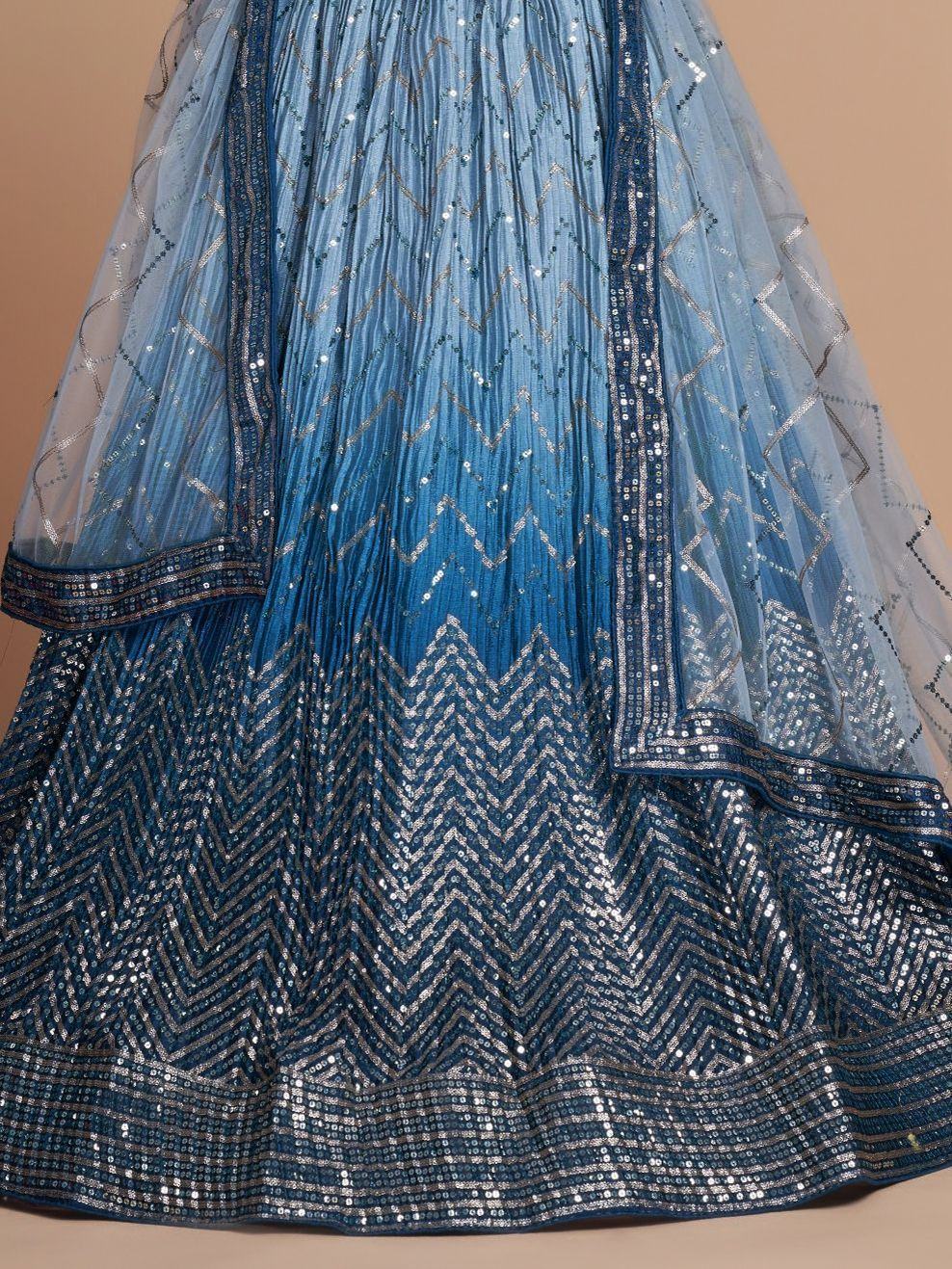 Blue ombre lehenga with silver chevron sequin embroidery and sheer dupatta