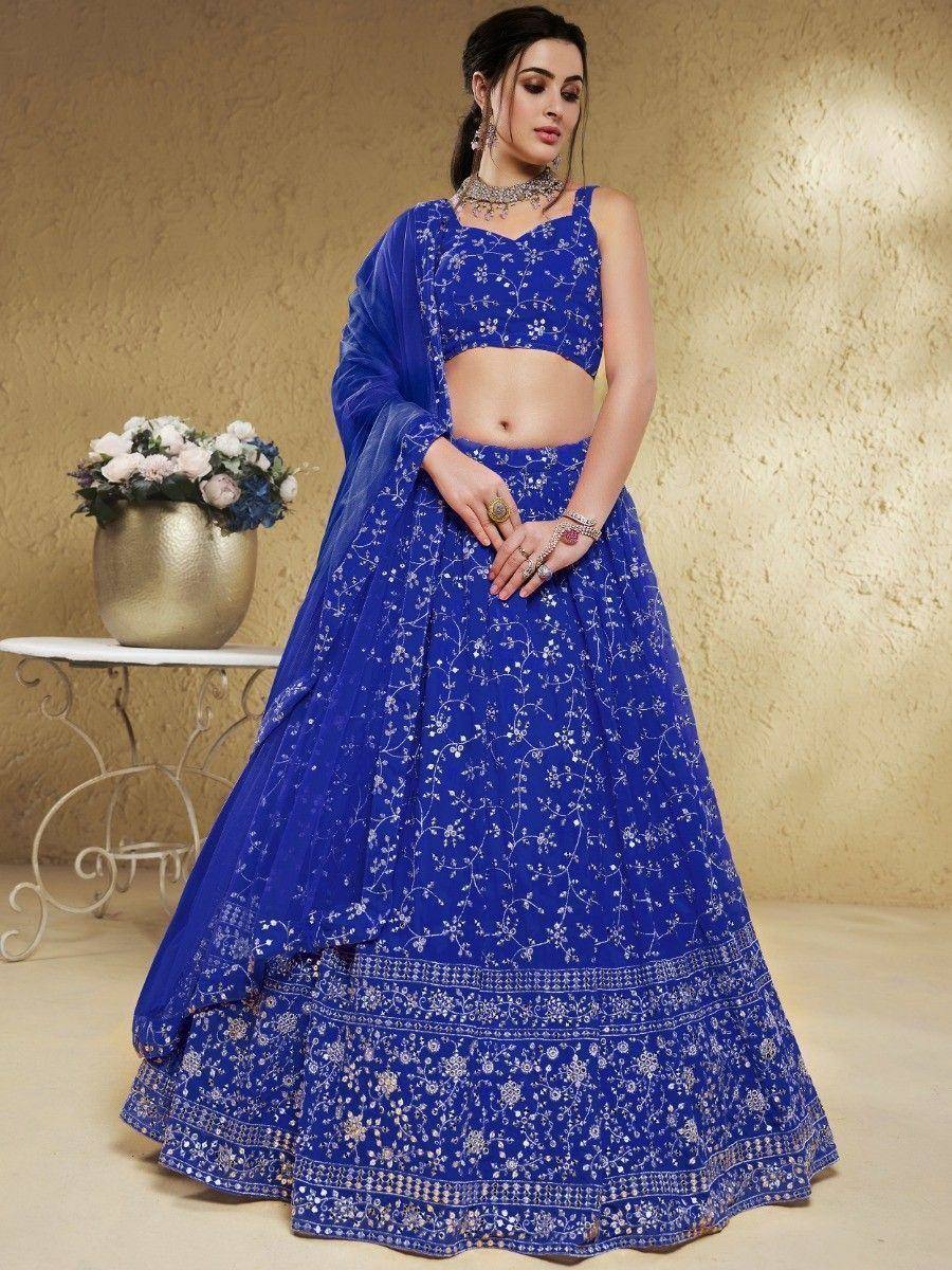 Royal blue embroidered lehenga choli with floral motifs, perfect for Indian ethnic wear and festive occasions.