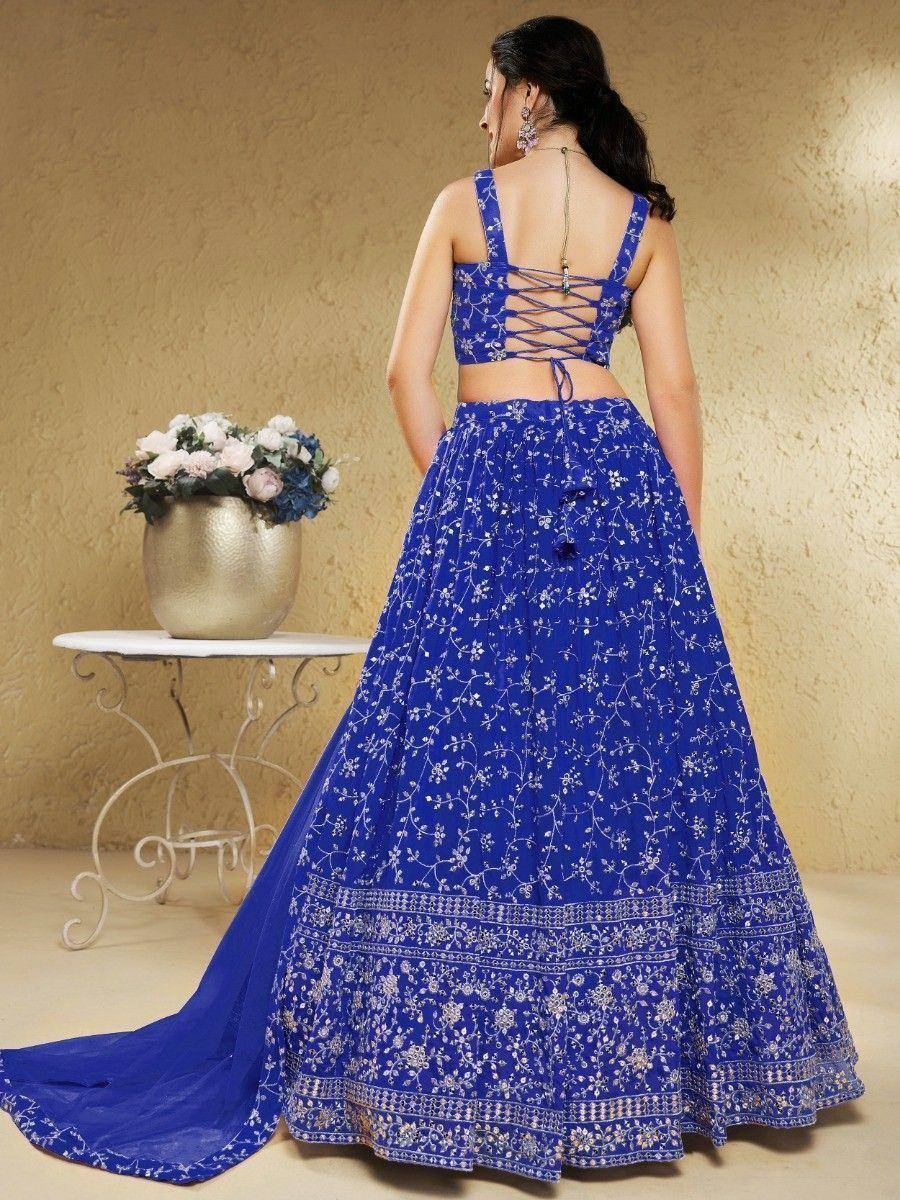 Royal blue embroidered lehenga choli with back tie-up design, perfect for Indian ethnic occasions