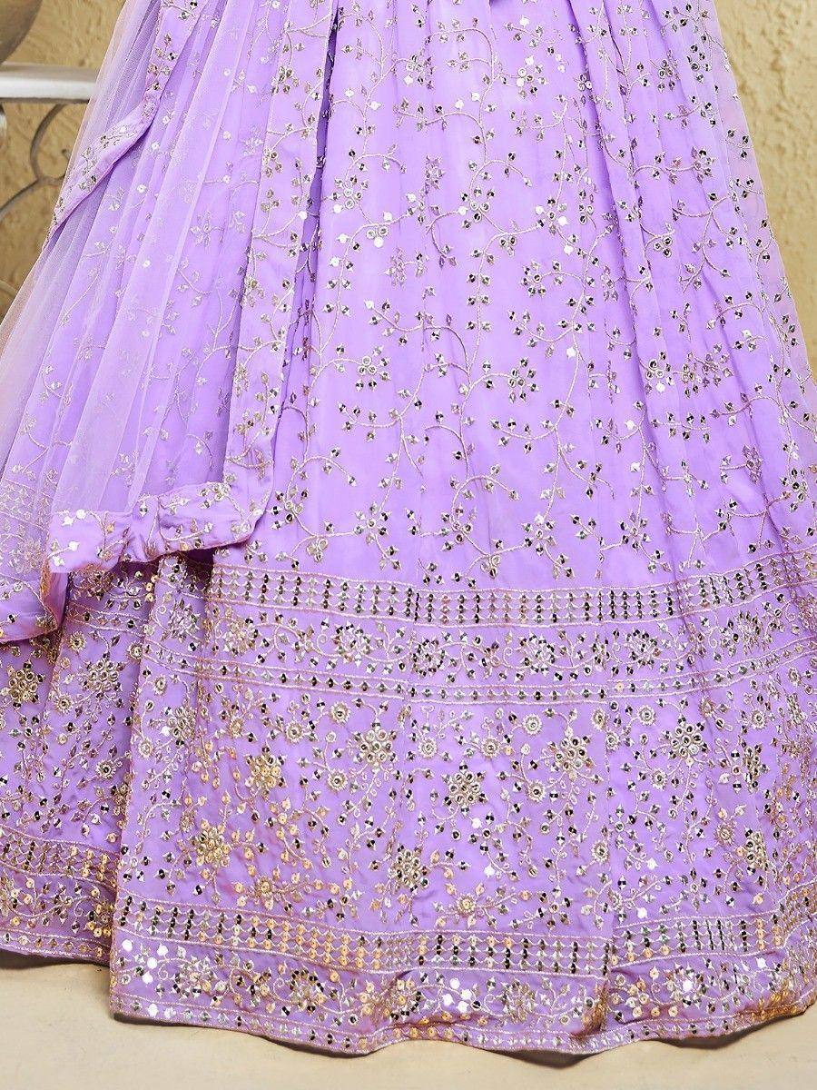 Lavender designer lehenga with intricate gold embroidery and mirror work, perfect for Indian ethnic occasions