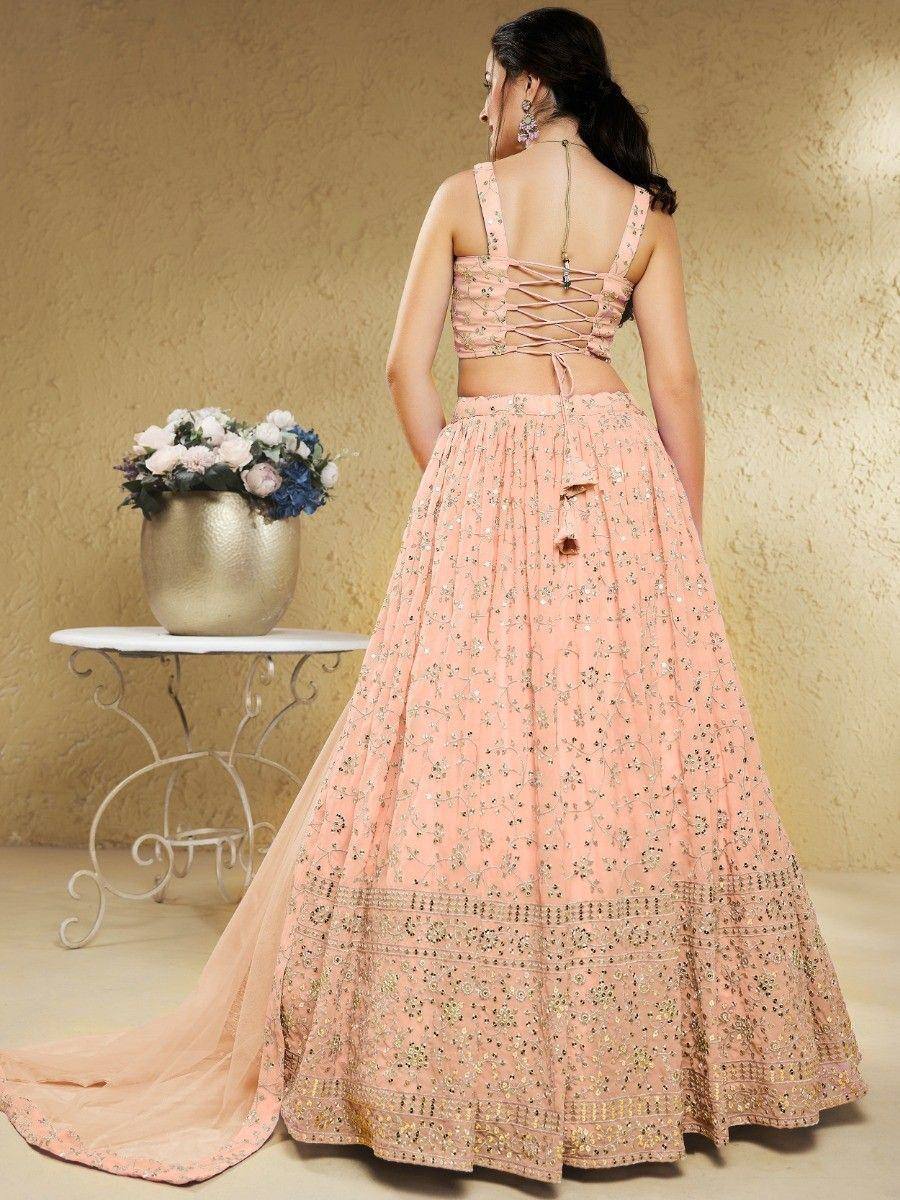 Pink embroidered lehenga choli with back lace-up blouse, perfect for Indian weddings and festive occasions