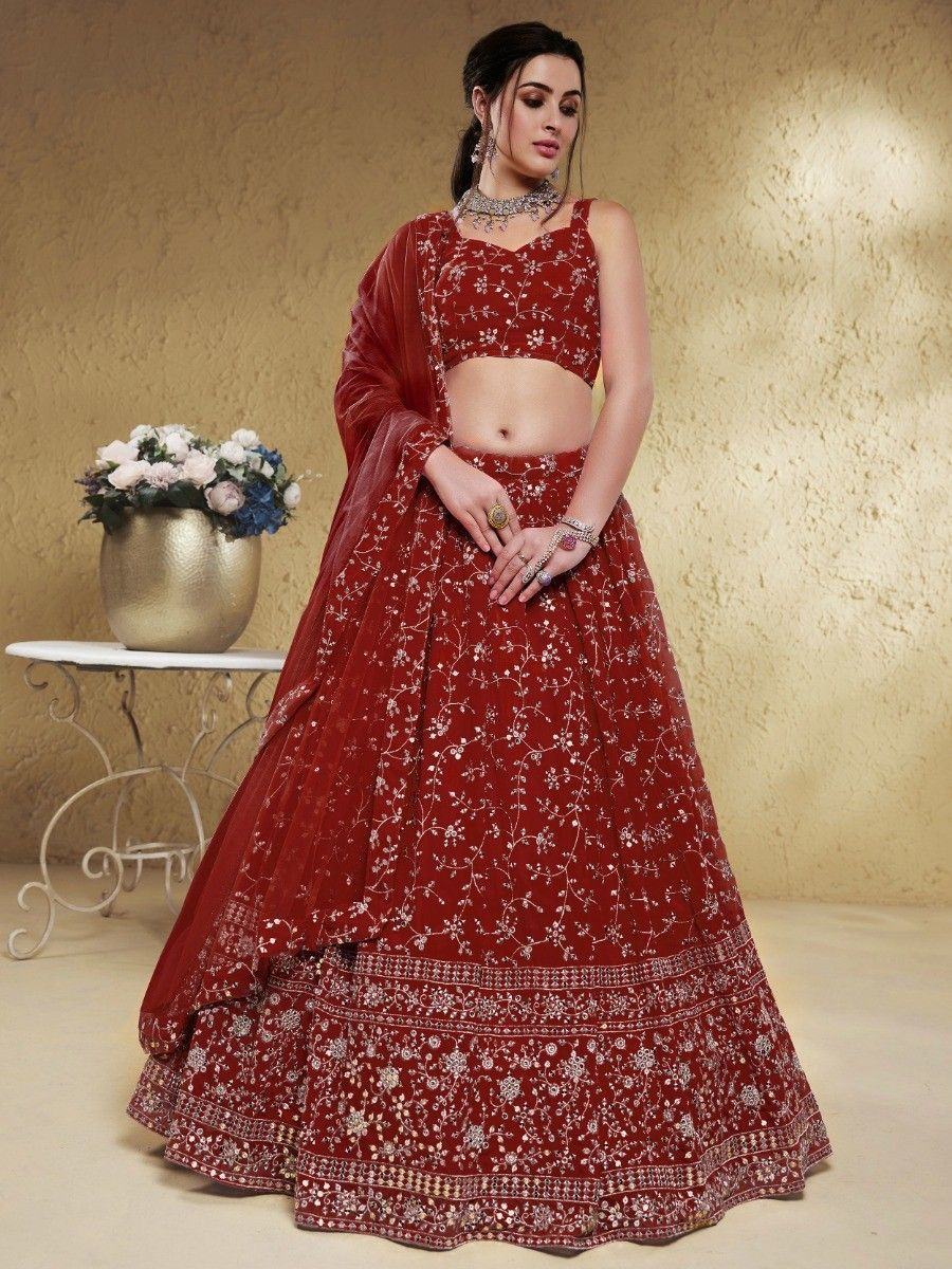 Red embroidered lehenga choli with floral detailing, perfect for Indian weddings and festive occasions