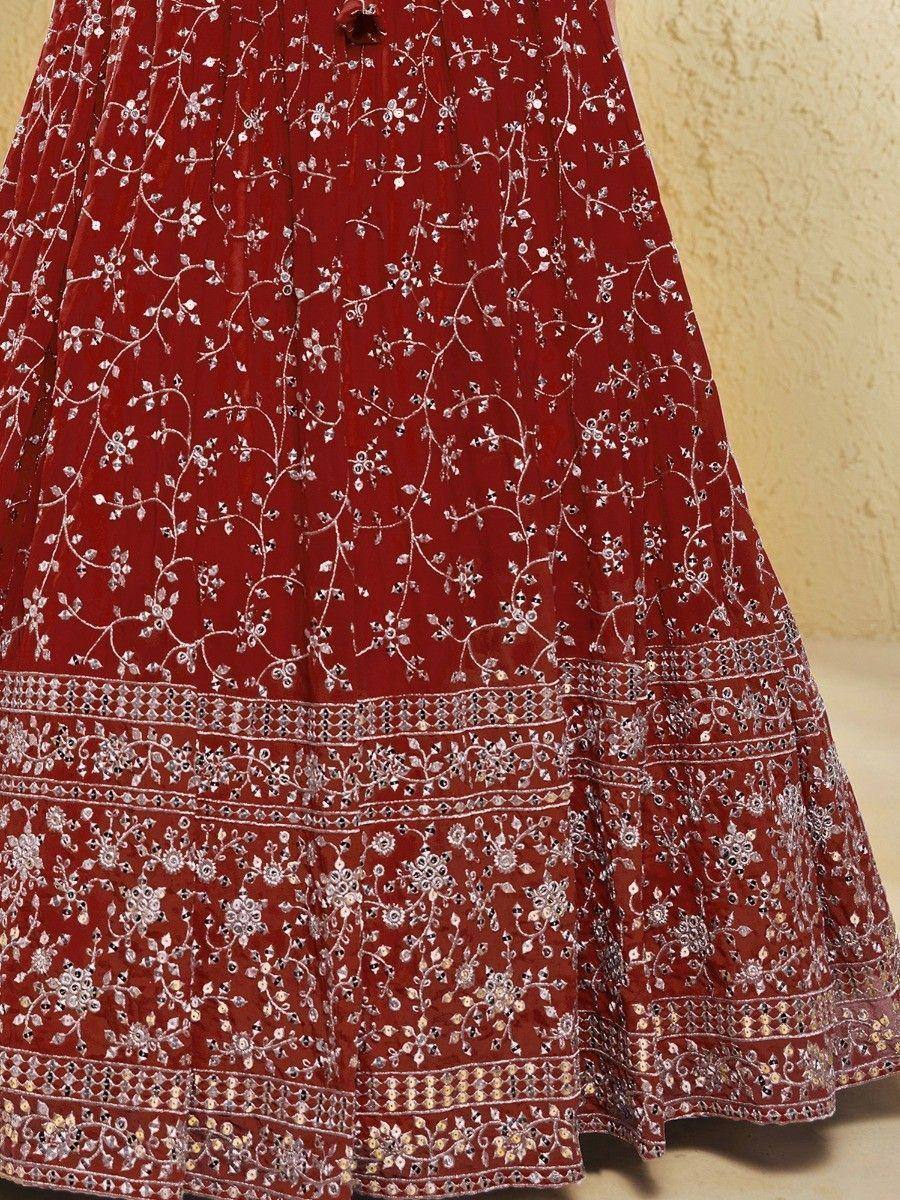 Red embroidered lehenga with intricate silver floral work and mirror detailing, perfect for Indian ethnic wear.