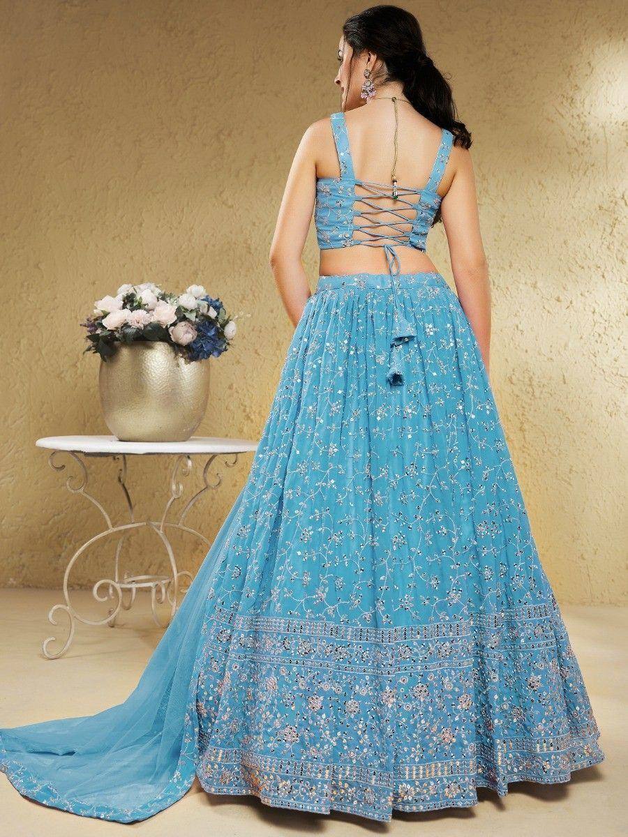 Blue embroidered lehenga choli with lace-up back, floral detailing, and flowing skirt for Indian ethnic wear