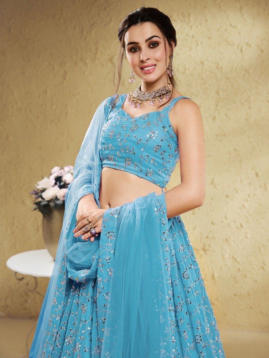 Blue embroidered lehenga choli with floral embellishments and matching dupatta