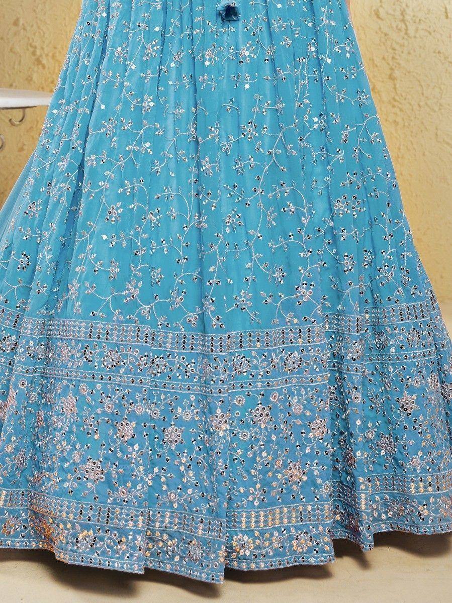 Blue embroidered lehenga skirt with floral mirror work and detailed border, ideal for Indian ethnic wear