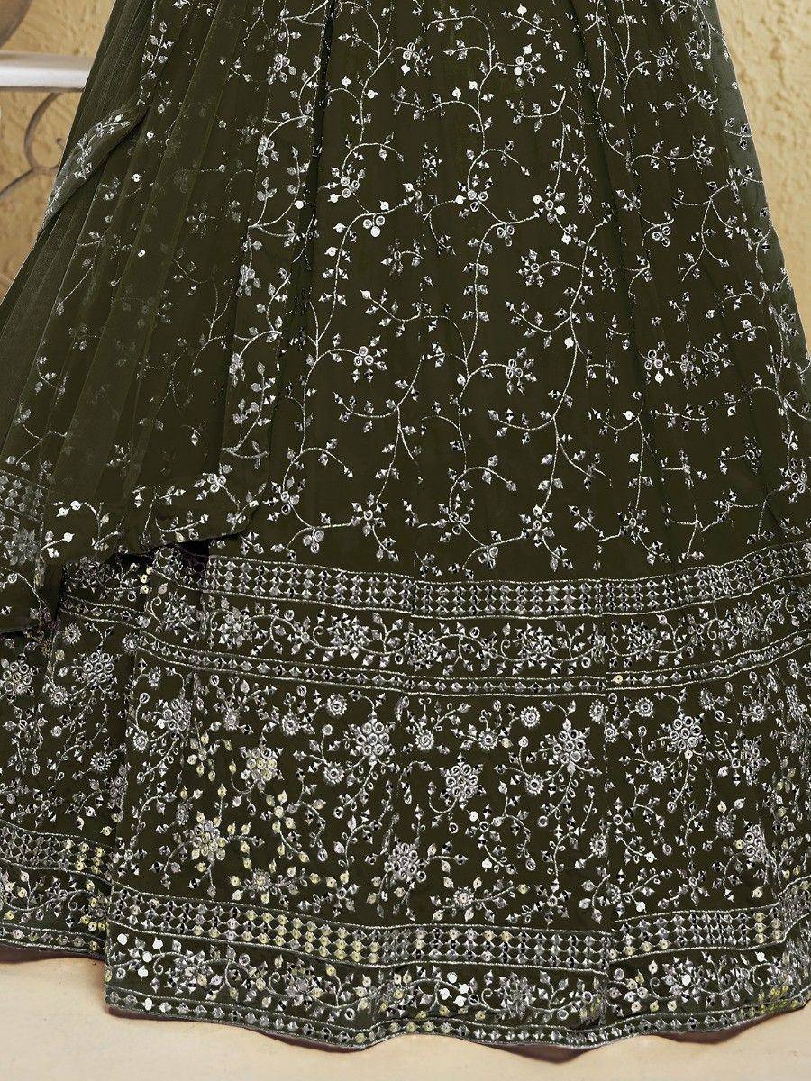 Olive green lehenga with silver floral embroidery and detailed border work, ideal for ethnic occasions.