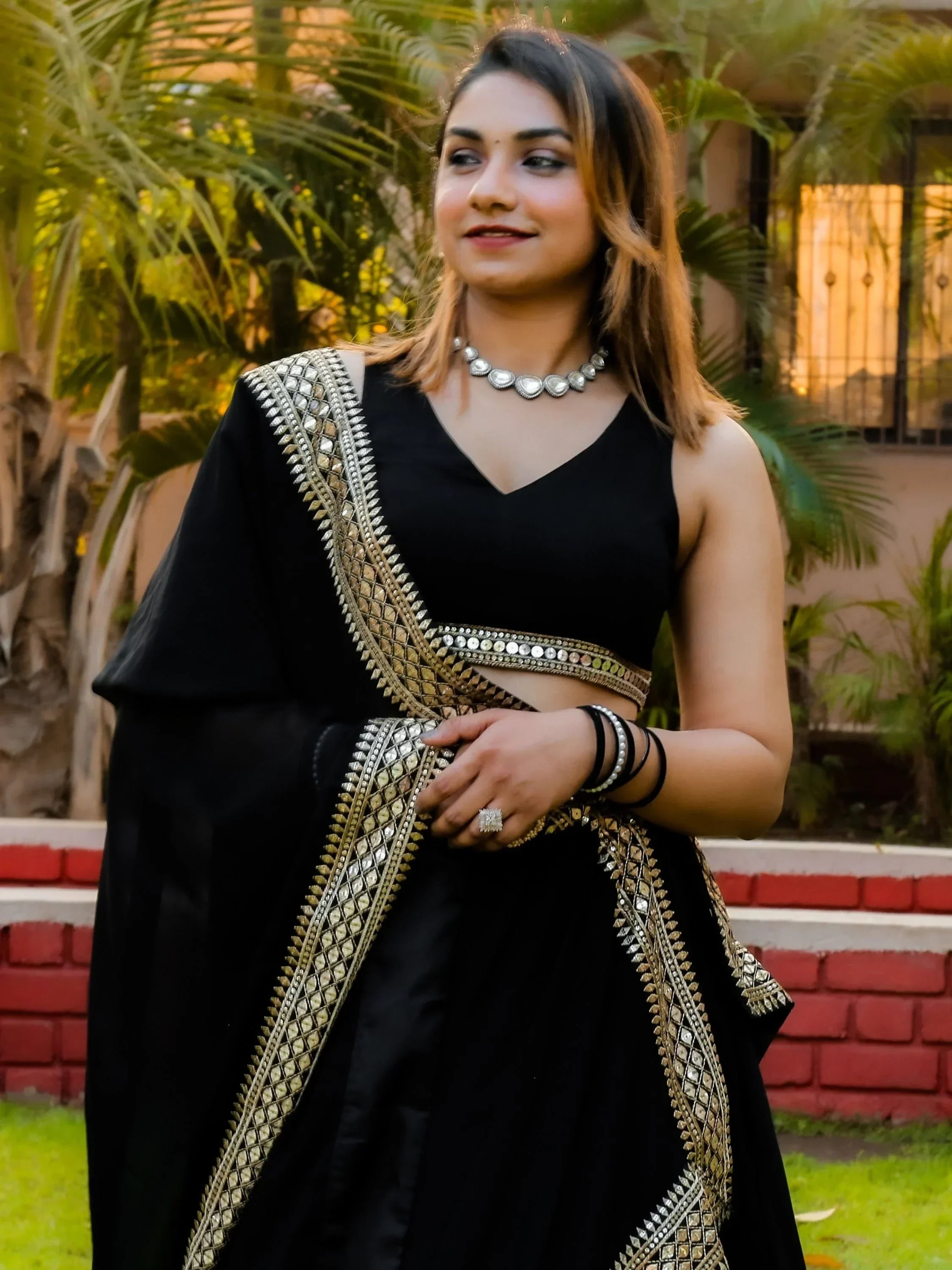 Black ethnic lehenga choli with gold mirror work, perfect for Indian weddings and parties