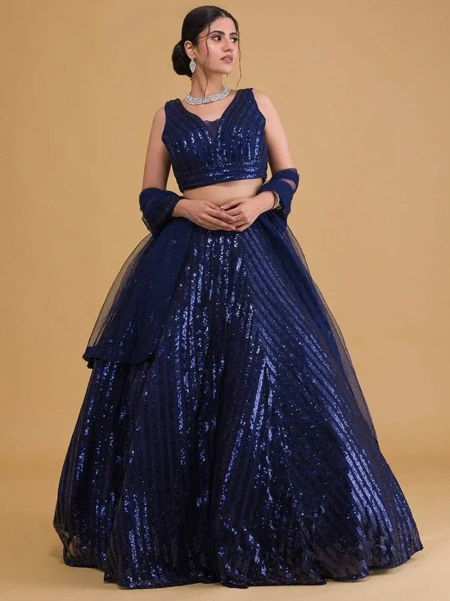 Navy blue sequin lehenga choli with sheer sleeves, perfect for weddings and festive occasions