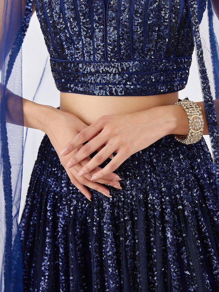 Navy blue sequin lehenga choli with sheer dupatta, perfect for Indian ethnic wear events