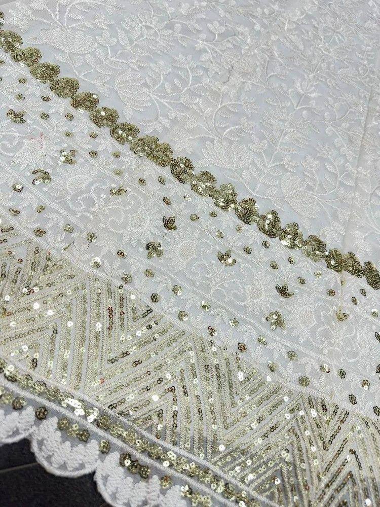 White ethnic gown with gold sequin embroidery and floral lace detailing