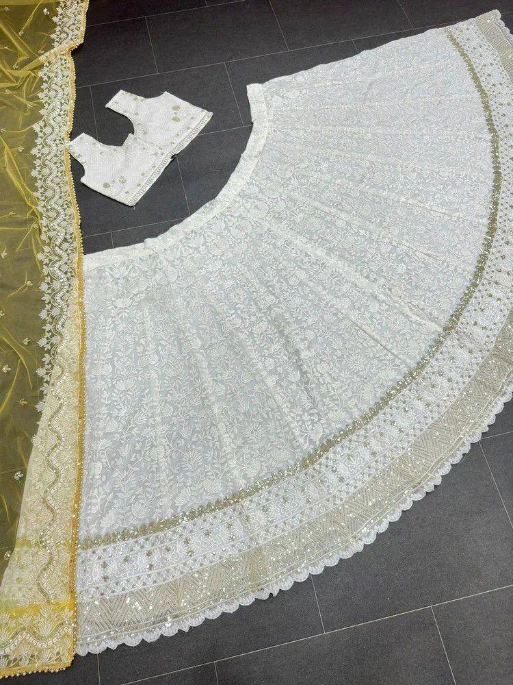 White lace lehenga choli with gold embroidery, perfect for Indian ethnic wear and festive occasions