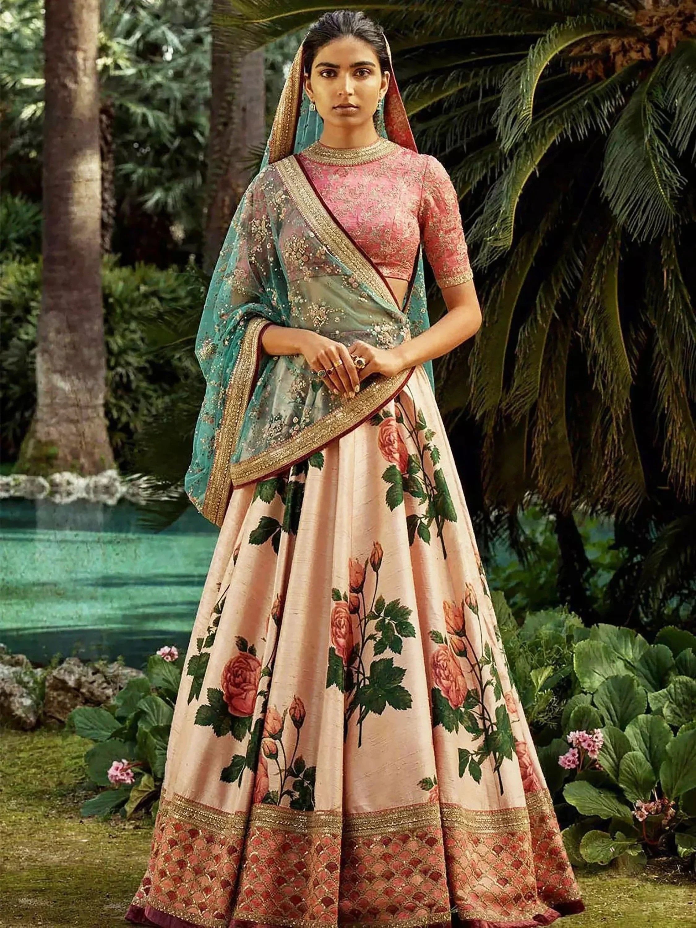 Floral print lehenga choli with pink blouse, teal dupatta, and gold embroidery for Indian ethnic wear