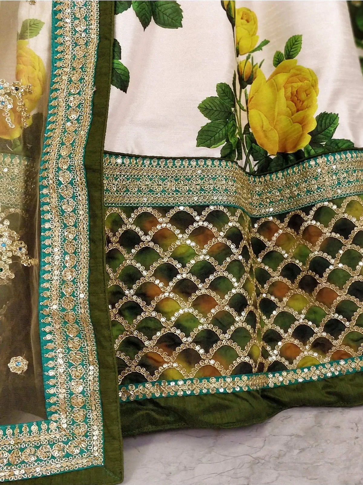 White floral lehenga with green border, gold sequin embroidery, and yellow rose print for Indian ethnic wear
