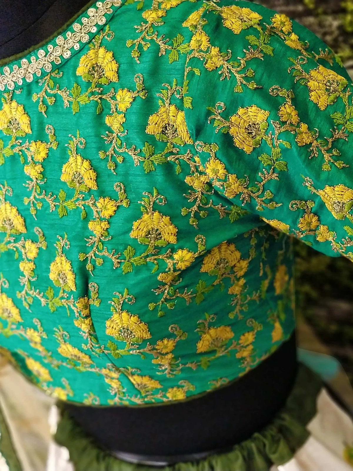 Green ethnic blouse with yellow floral embroidery, perfect for Indian wear