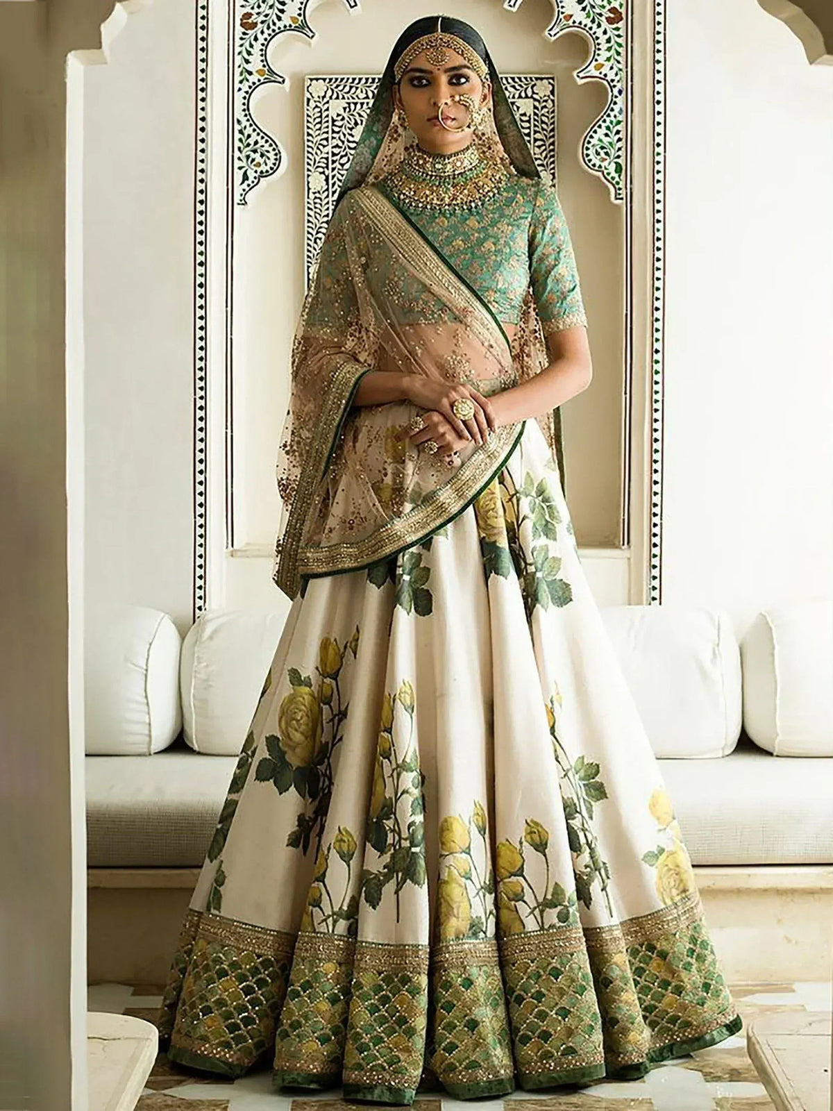 Elegant Indian bridal lehenga choli with floral print, gold embroidery, and matching dupatta for wedding wear