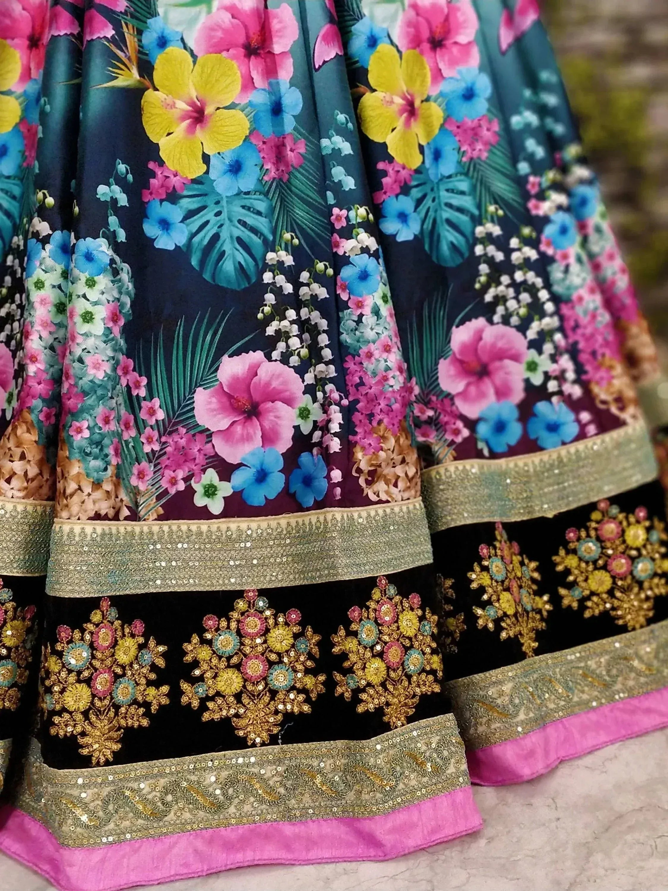 Vibrant floral print lehenga with sequin embroidery and pink border, ideal for Indian ethnic wear