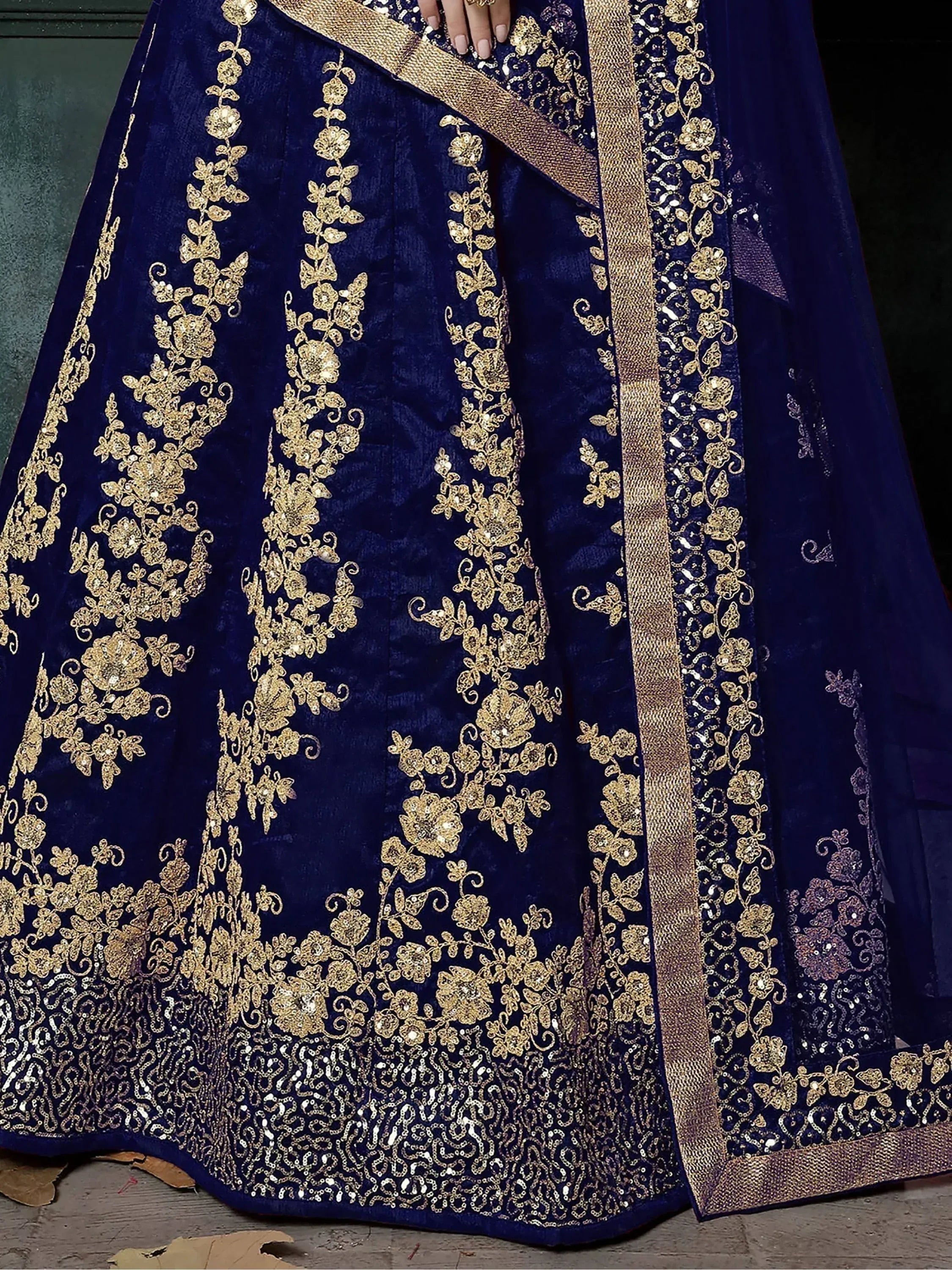 Royal blue velvet lehenga with gold floral embroidery and sequin detailing for Indian ethnic wear