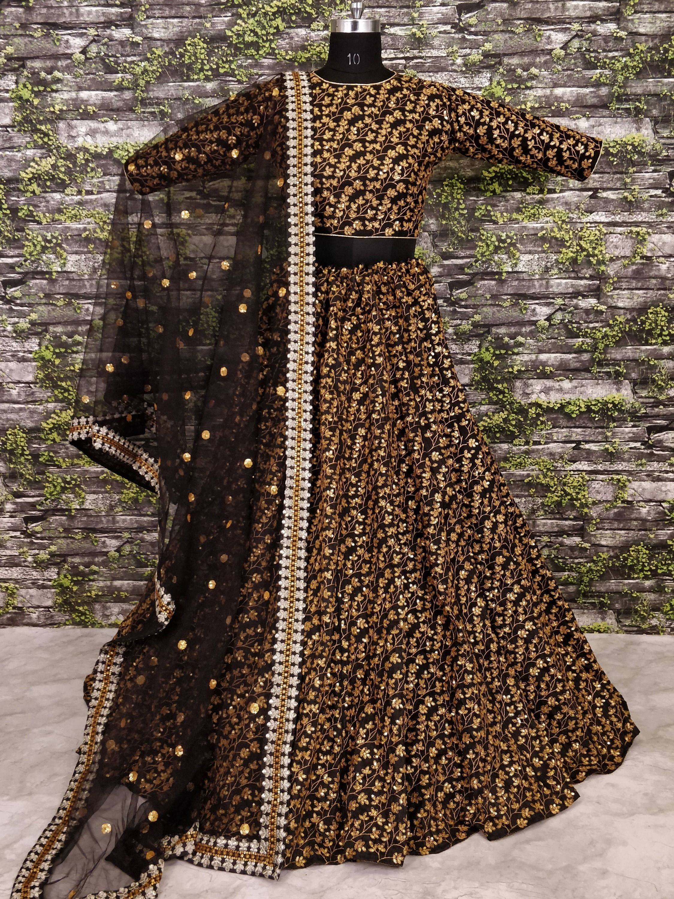 Black and gold embroidered lehenga choli with sheer dupatta, perfect for Indian ethnic wear events