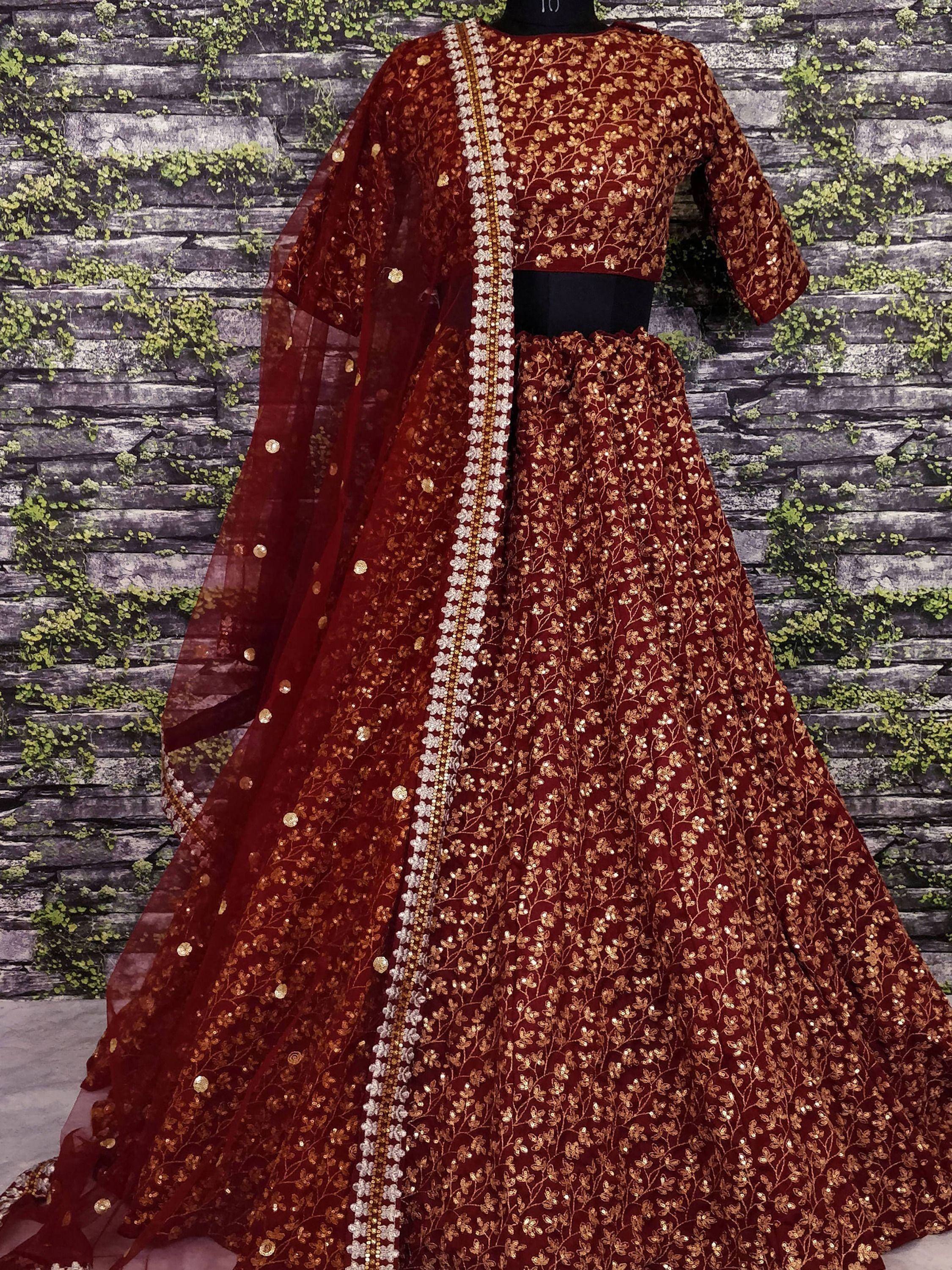 Maroon lehenga choli with gold floral embroidery and sequins, perfect for Indian ethnic wear occasions