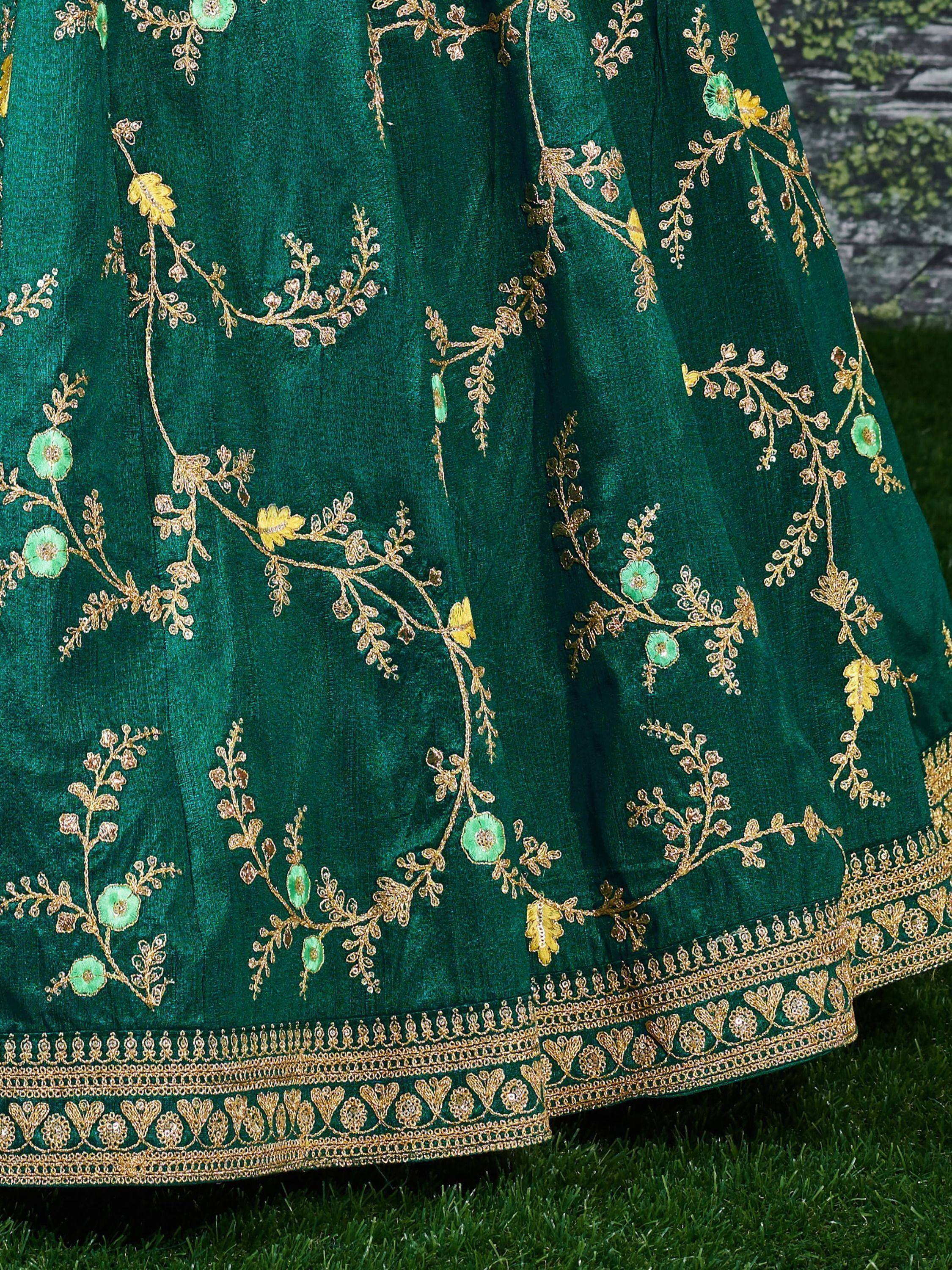 Emerald green lehenga with gold floral embroidery and intricate border, ideal for Indian ethnic wear.