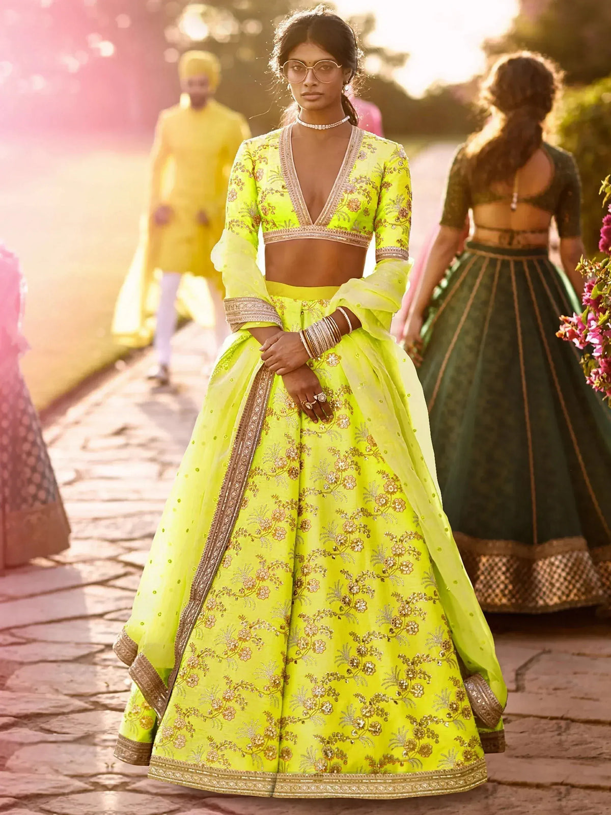 Vibrant neon green embroidered lehenga choli with floral motifs, perfect for Indian ethnic wear occasions.