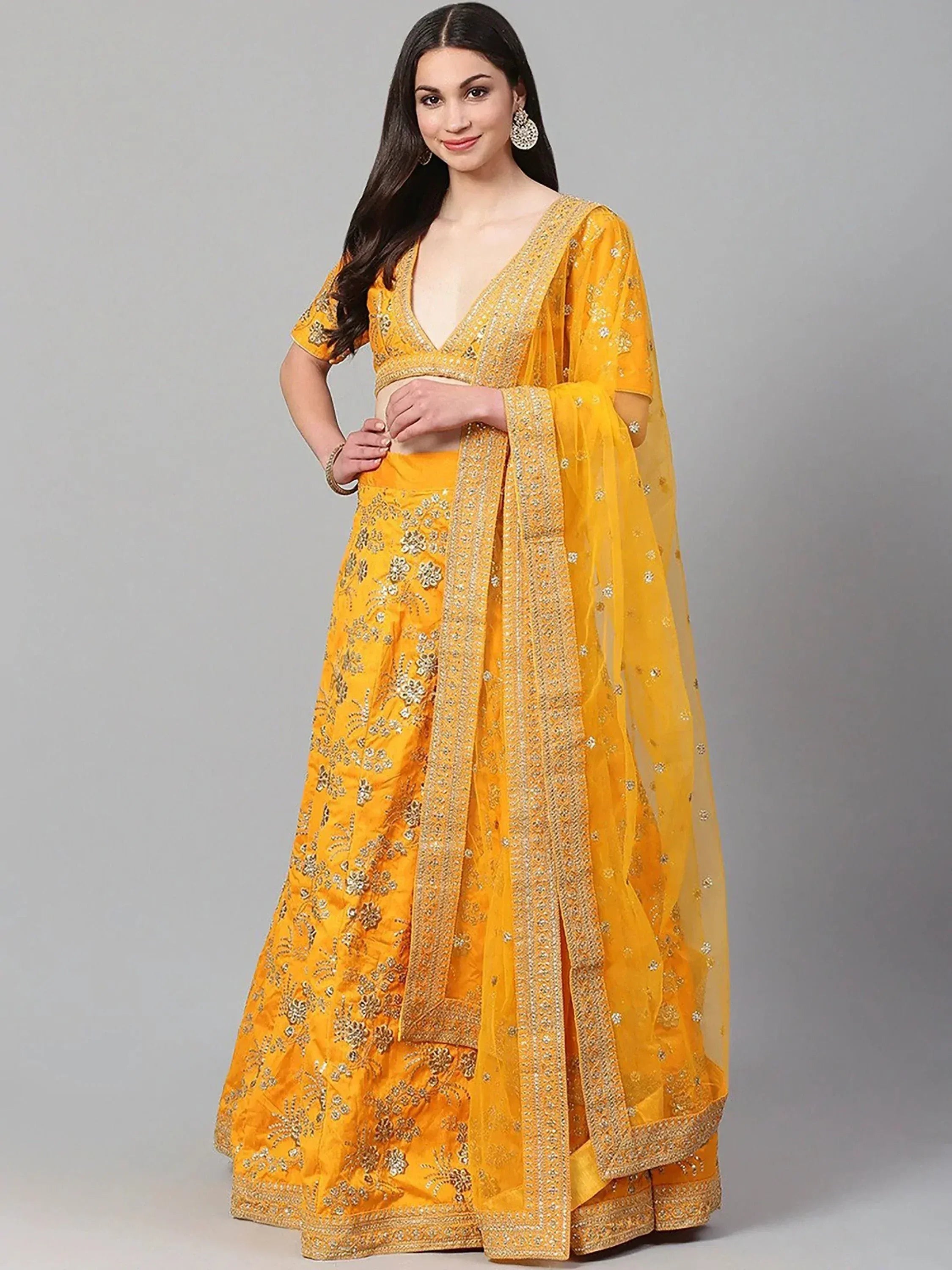 Yellow designer lehenga choli with gold embroidery and sheer dupatta, ethnic Indian wear