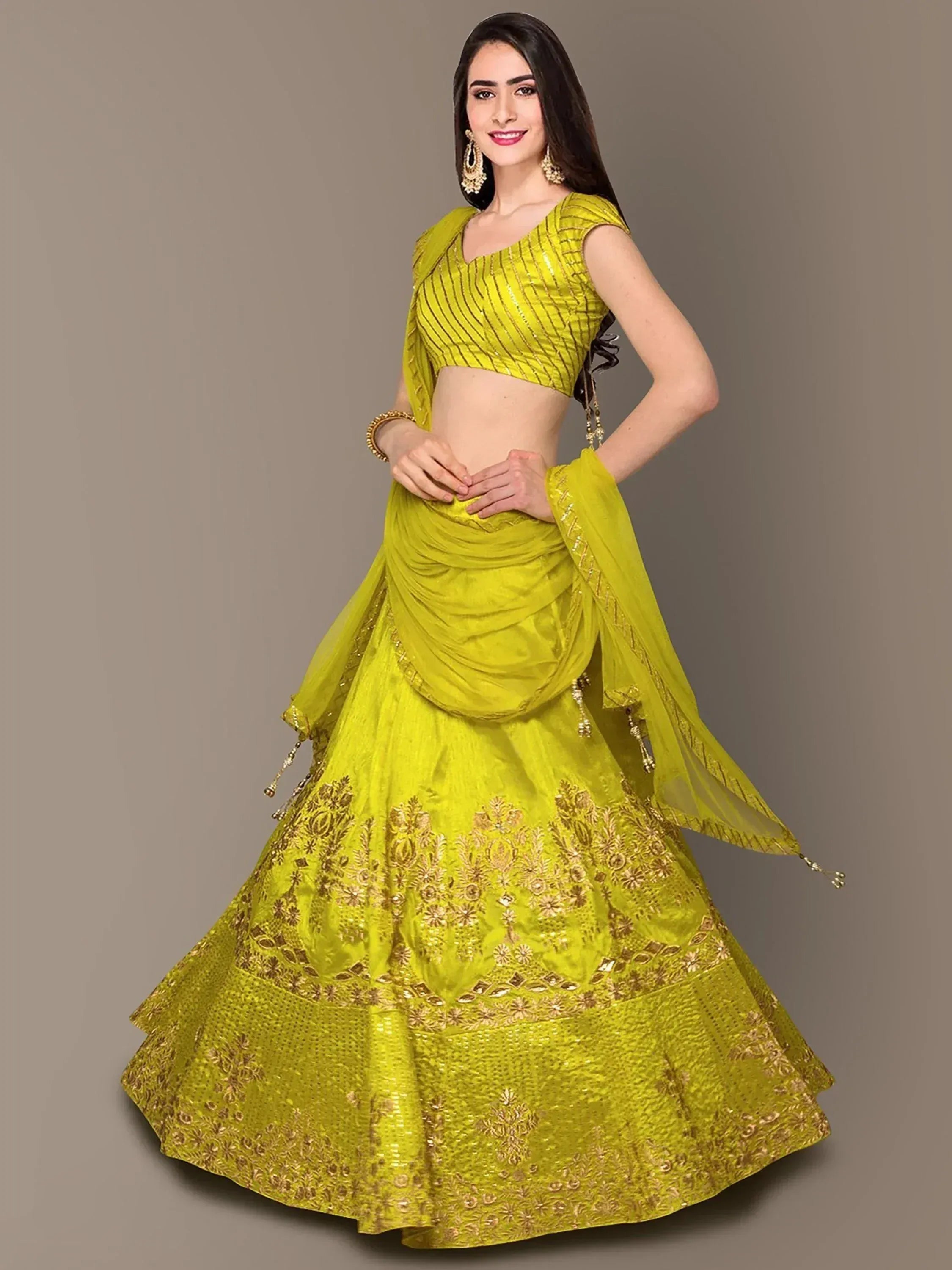 Vibrant yellow designer lehenga choli with gold embroidery, perfect for Indian ethnic wear occasions
