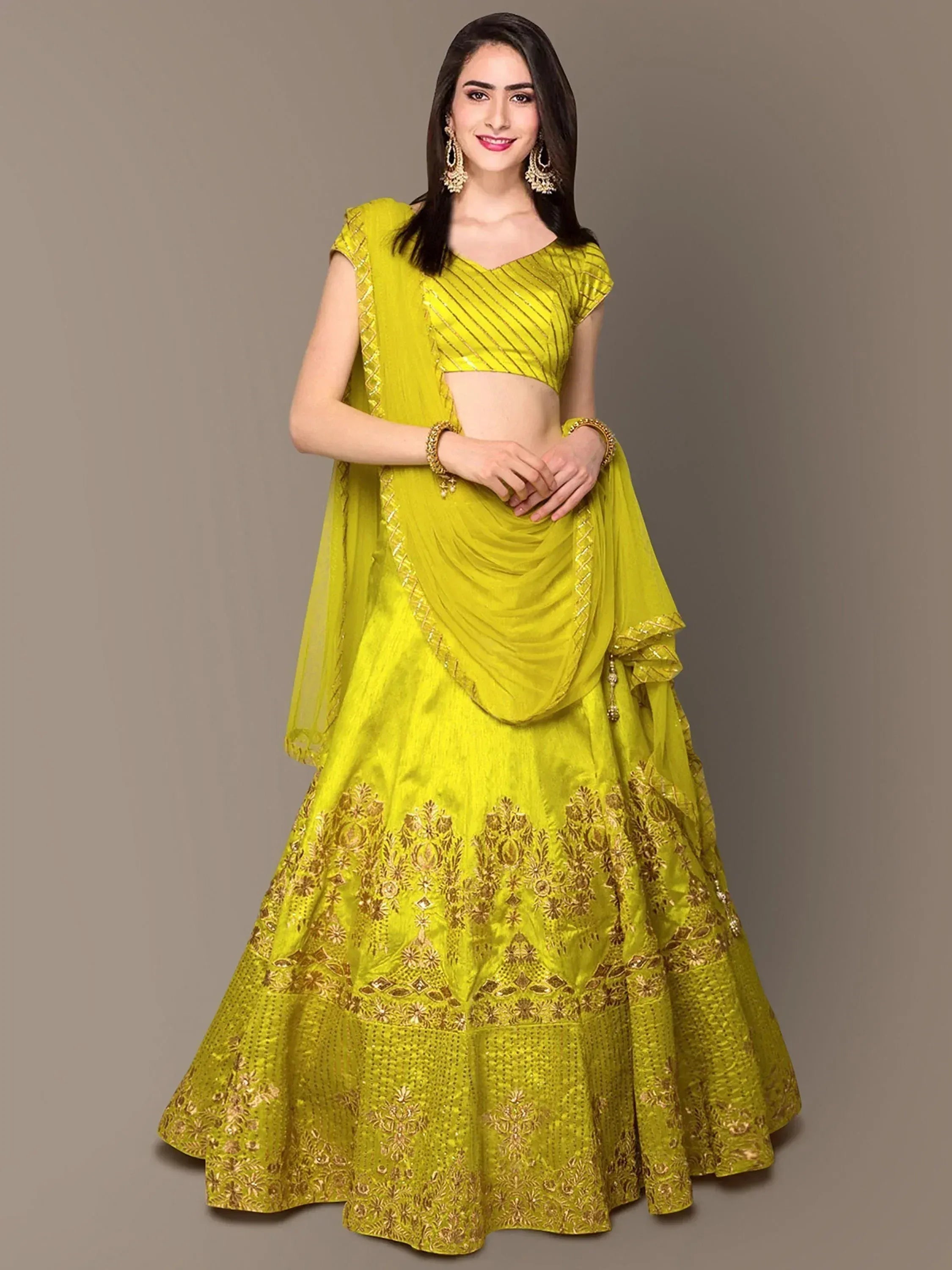 Vibrant yellow lehenga choli with gold embroidery, perfect for Indian ethnic wear and festive occasions.