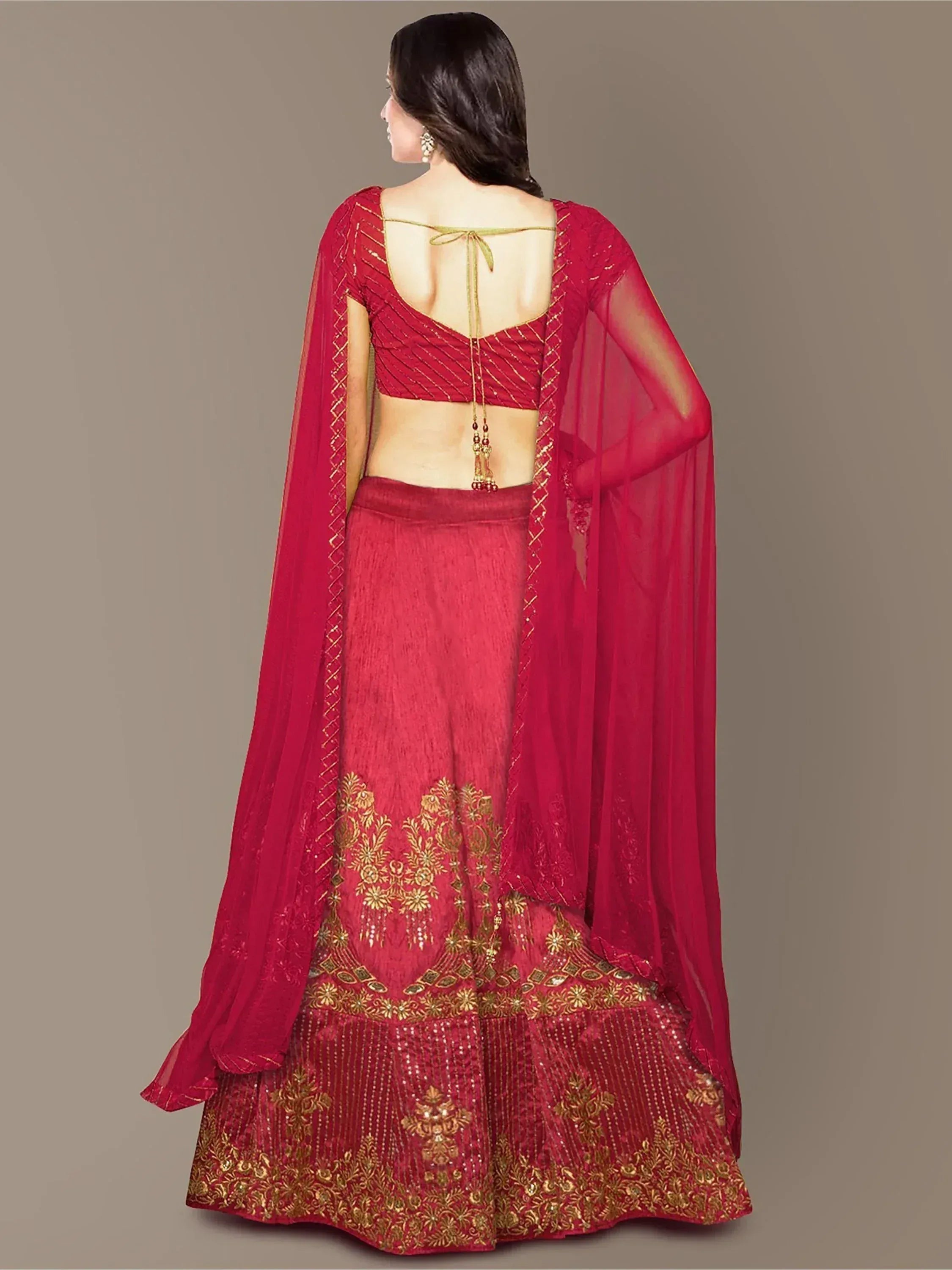 Red designer lehenga choli with gold embroidery and sheer dupatta, back view