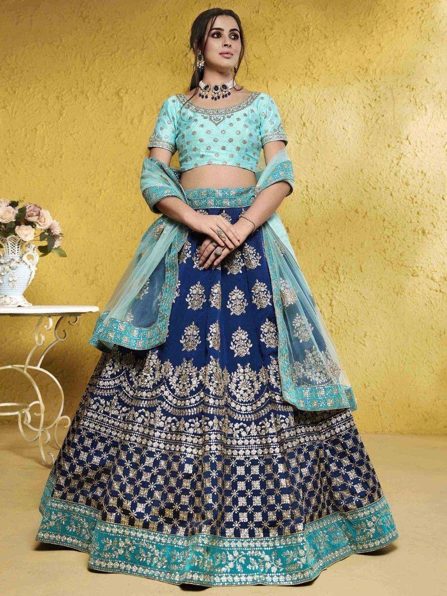 Blue and turquoise embroidered lehenga choli with floral patterns, perfect for Indian ethnic wear occasions
