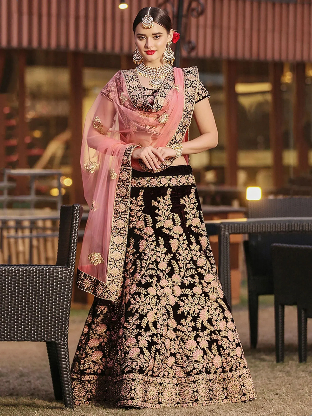 Black and pink embroidered lehenga choli with floral gold detailing, perfect for Indian weddings and festive occasions.