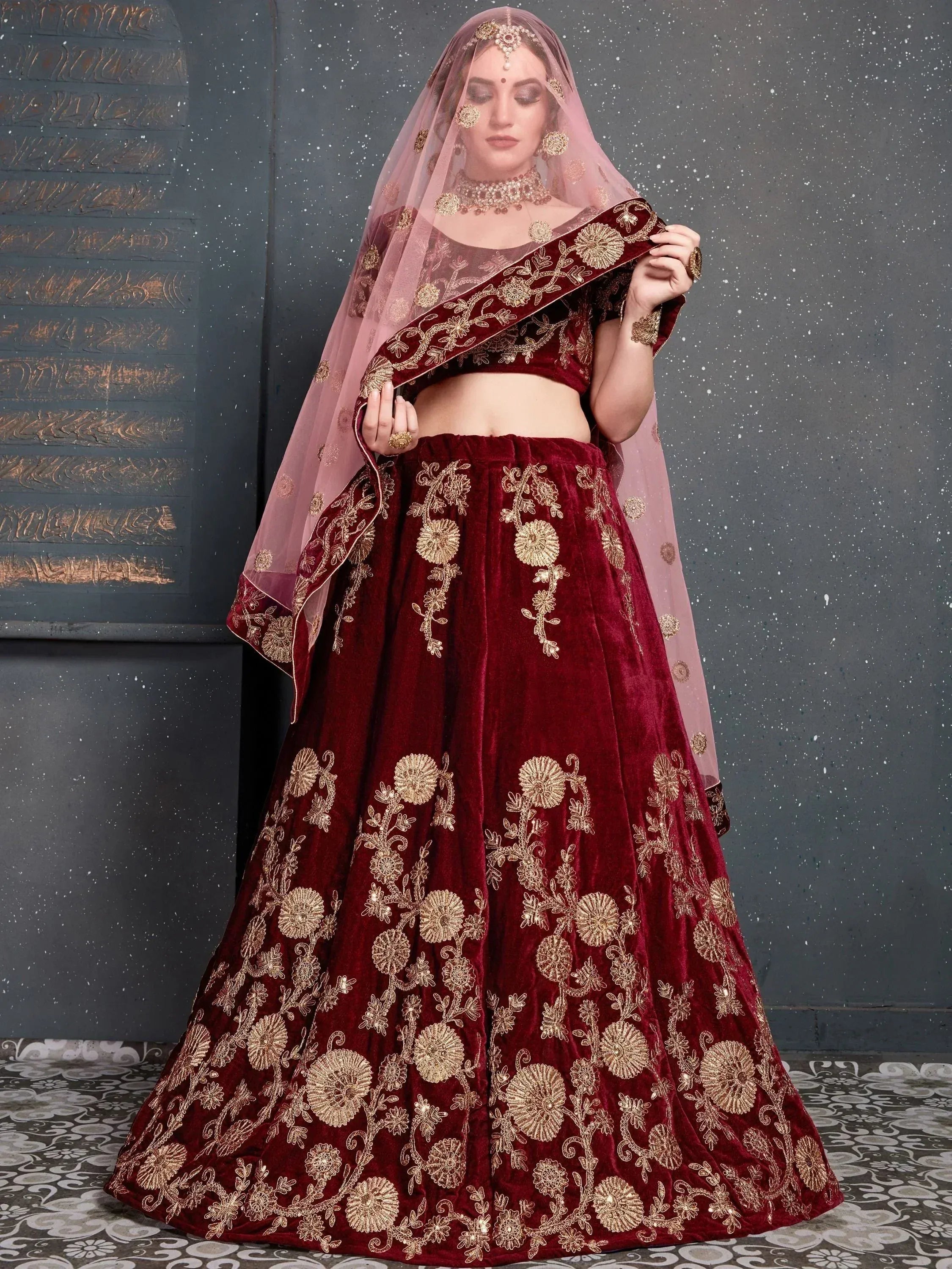 Maroon velvet lehenga choli with gold floral embroidery and sheer dupatta, Indian ethnic wear