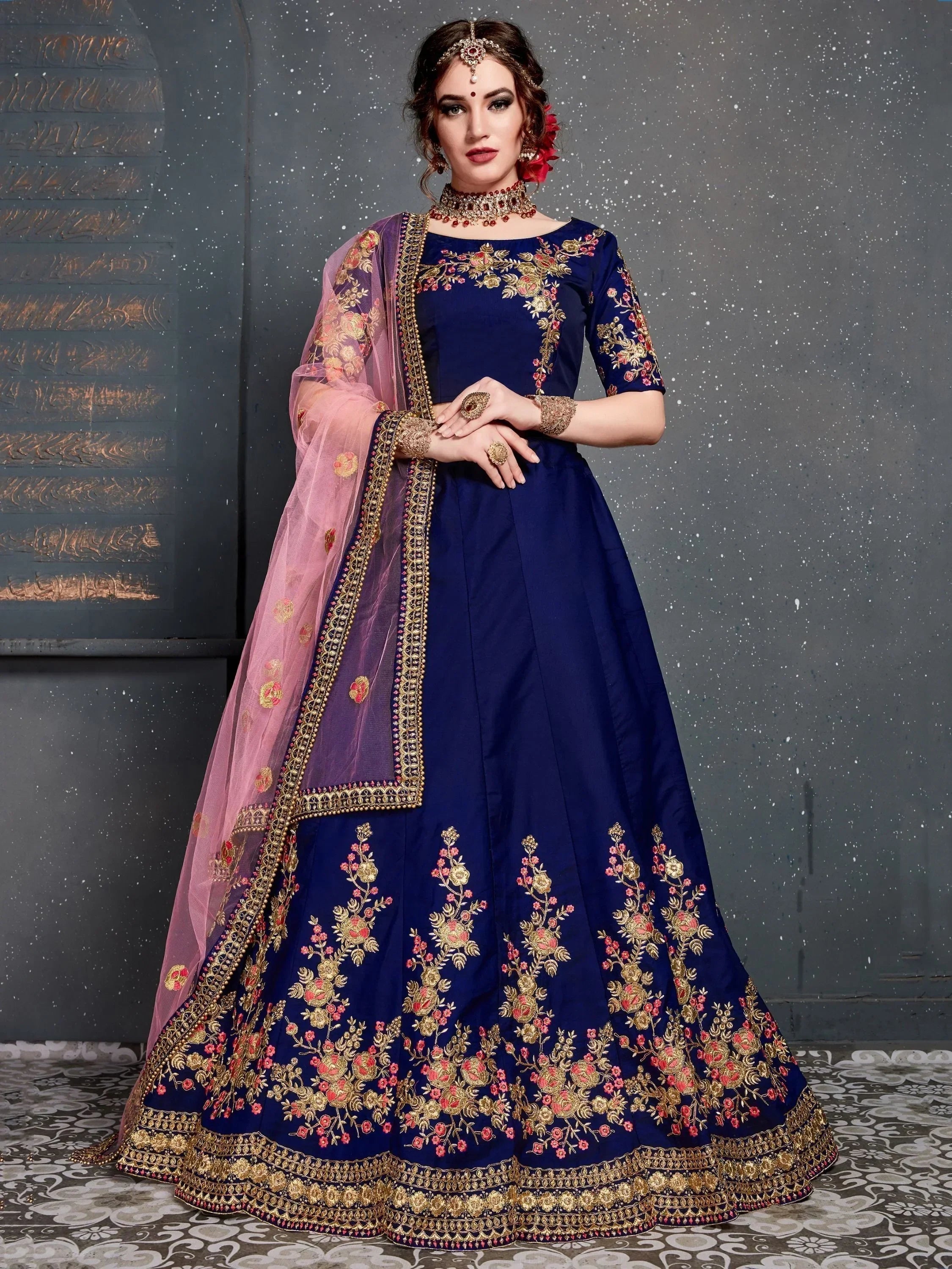Navy blue embroidered lehenga choli with pink dupatta, floral gold detailing, perfect for Indian weddings and festivals