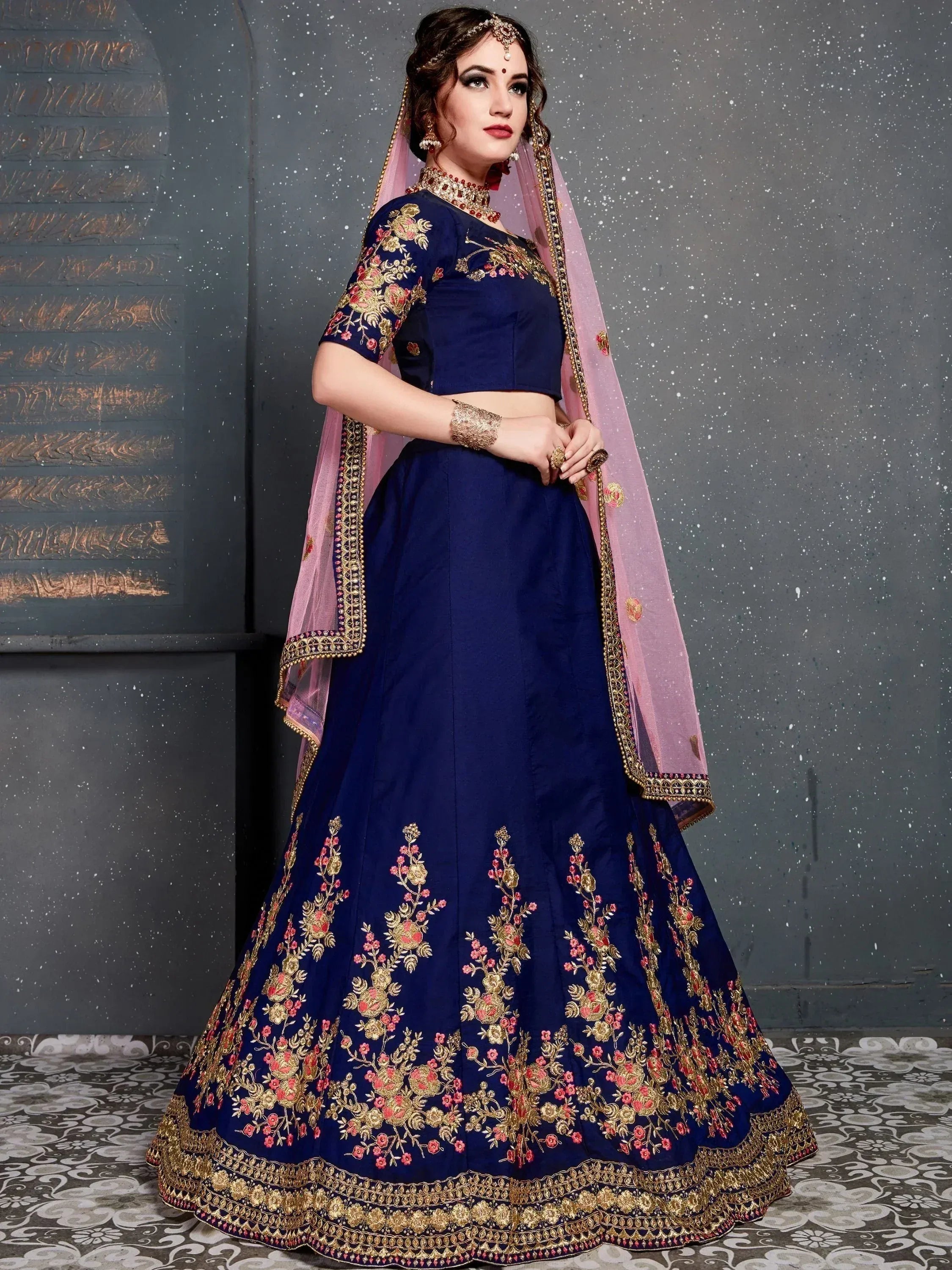 Navy blue embroidered lehenga choli with pink dupatta, floral gold detailing, perfect for Indian weddings