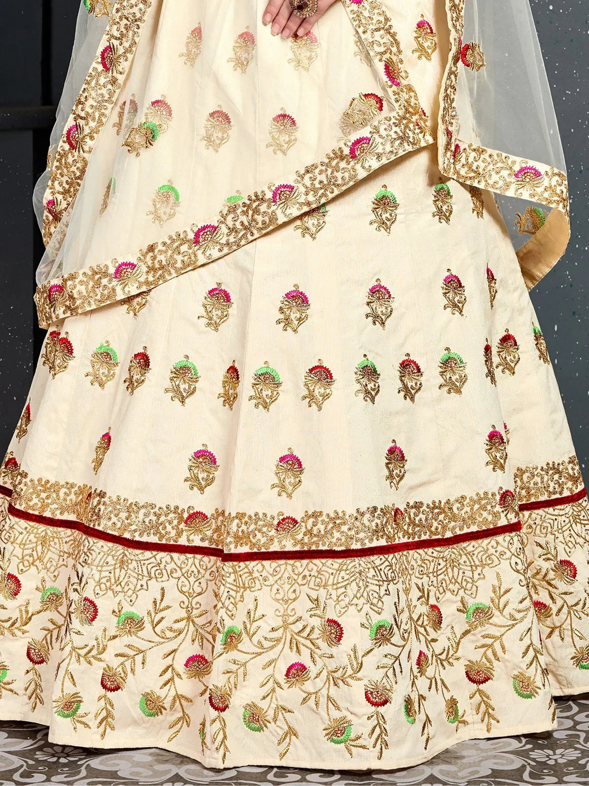 Cream embroidered lehenga choli with gold, pink, green floral motifs and red velvet border, Indian ethnic wear